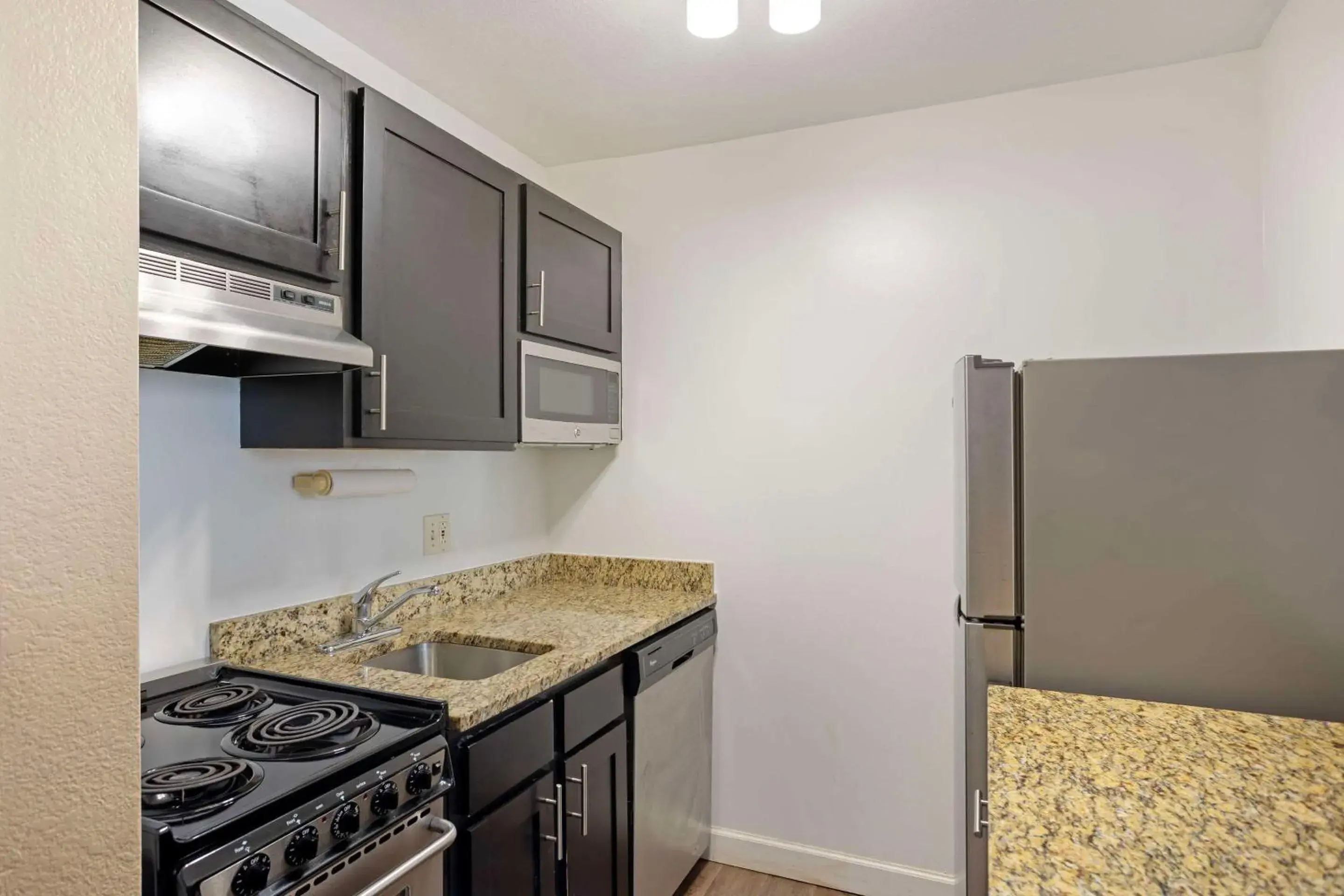 Bedroom, Kitchen/Kitchenette in MainStay Suites Mt Laurel - Philadelphia