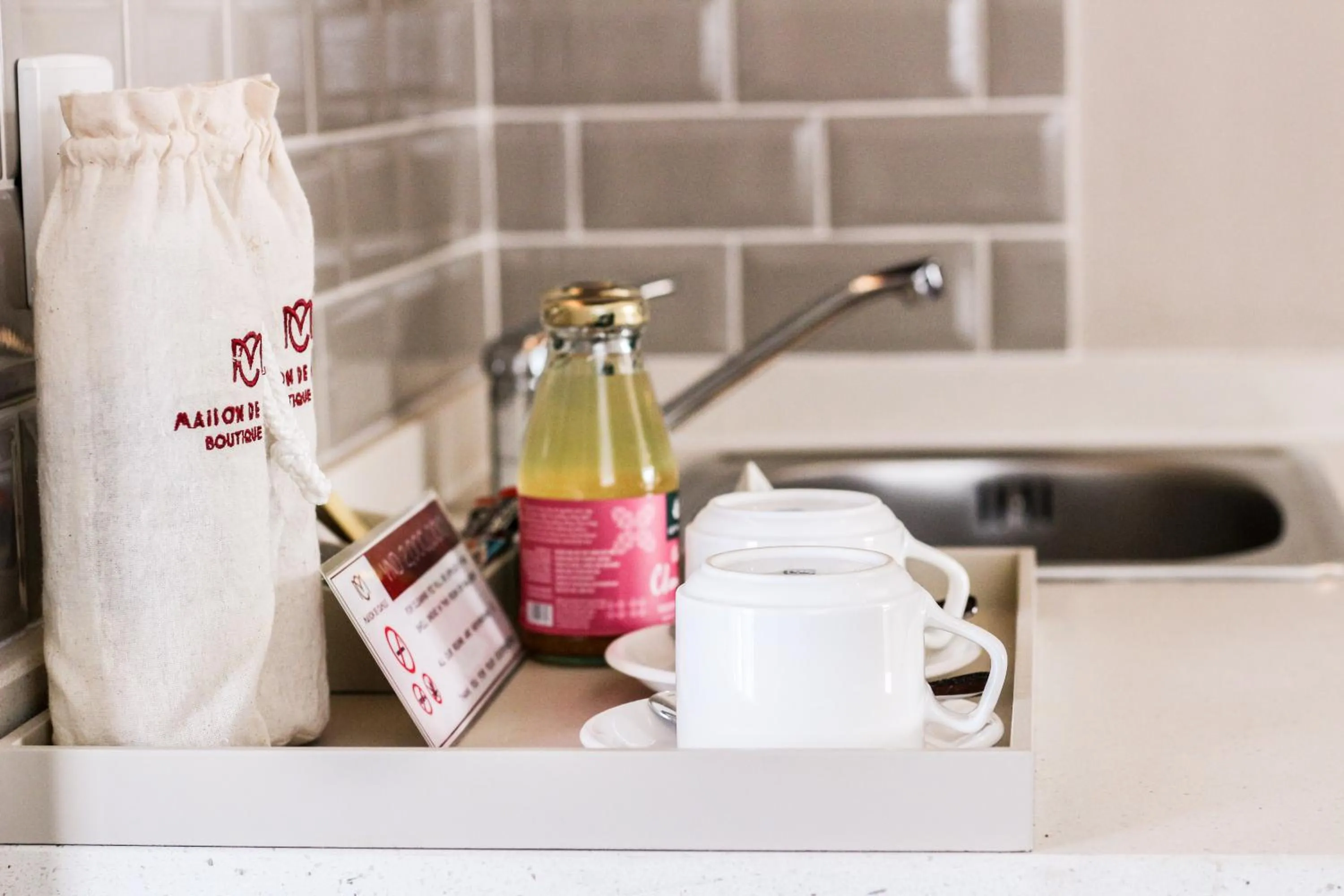 Communal kitchen in Maison De Camille Boutique Hotel