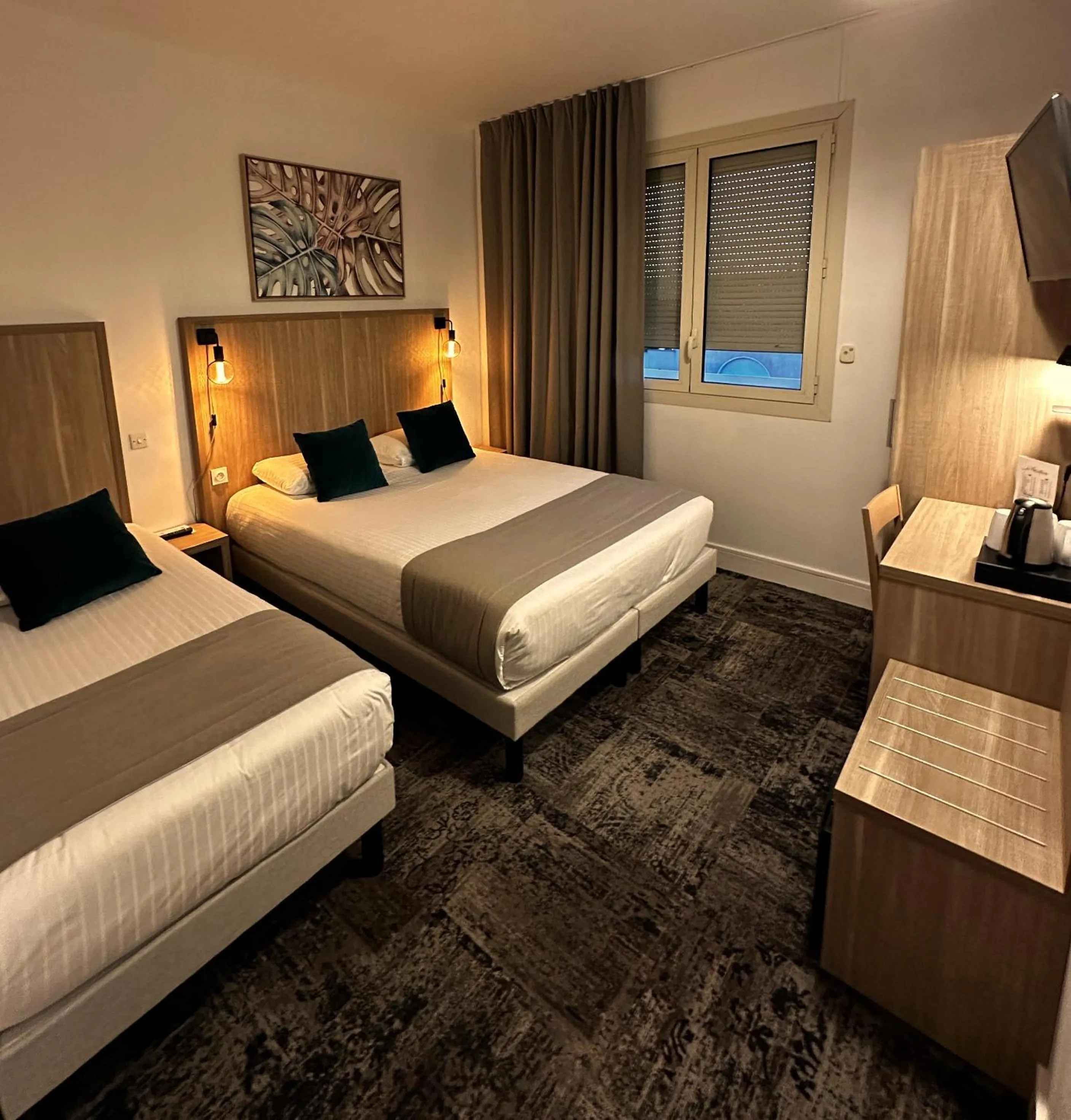 Photo of the whole room, Bed in Logis Le Passiflore Cognac