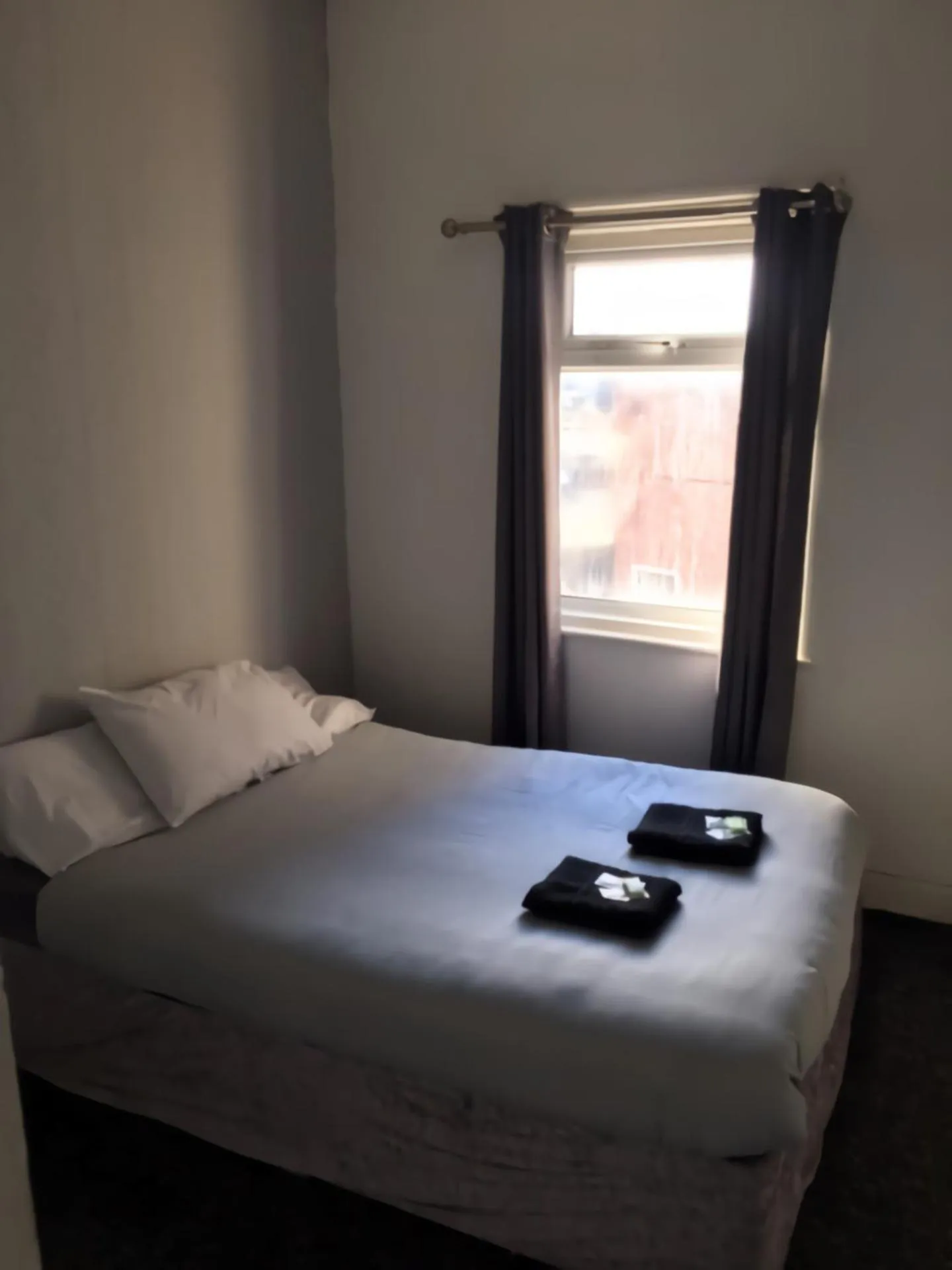 Bed in MyRoomz Seaview Hotel