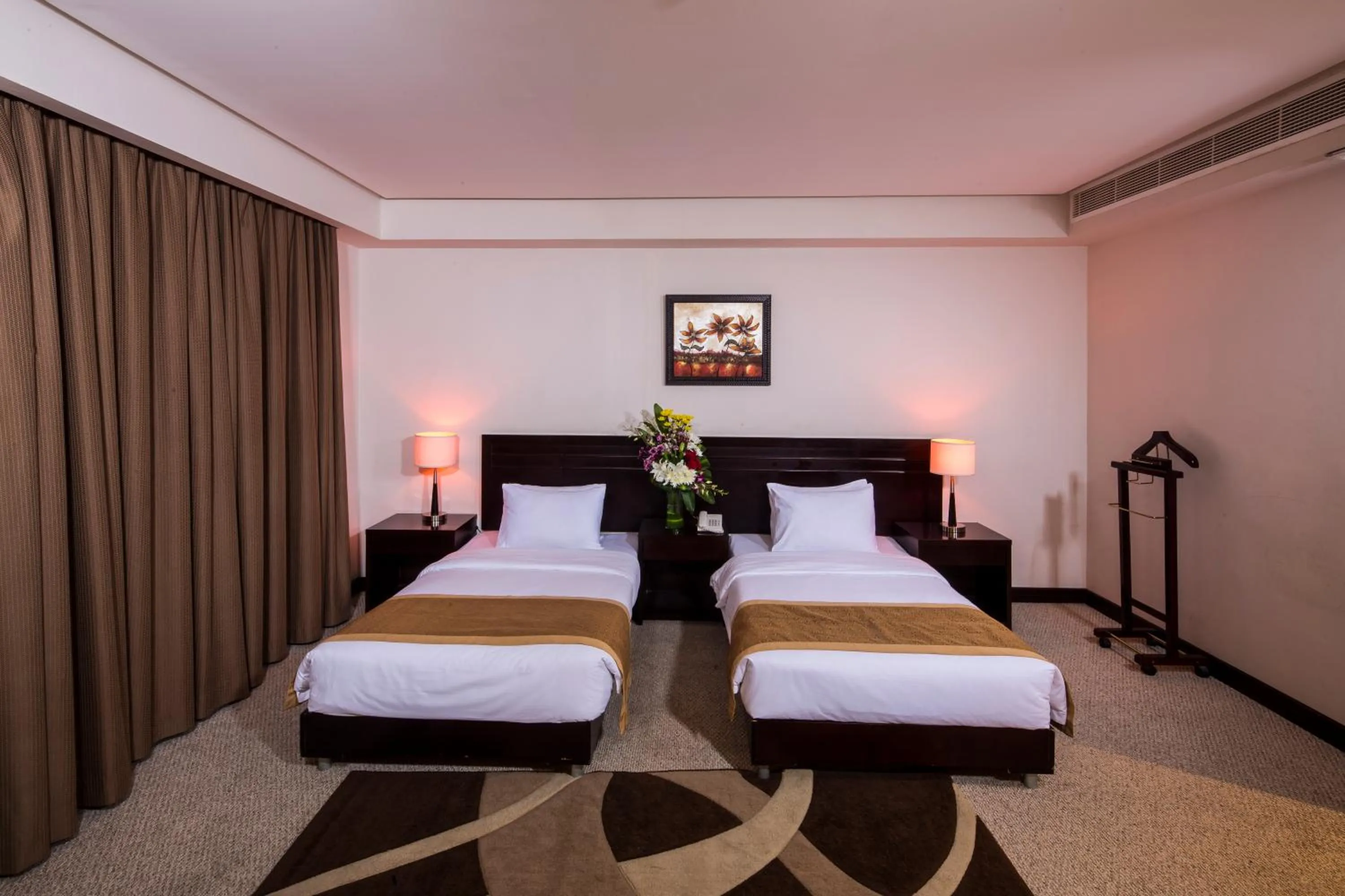 Bed in Monroe Hotel & Suites