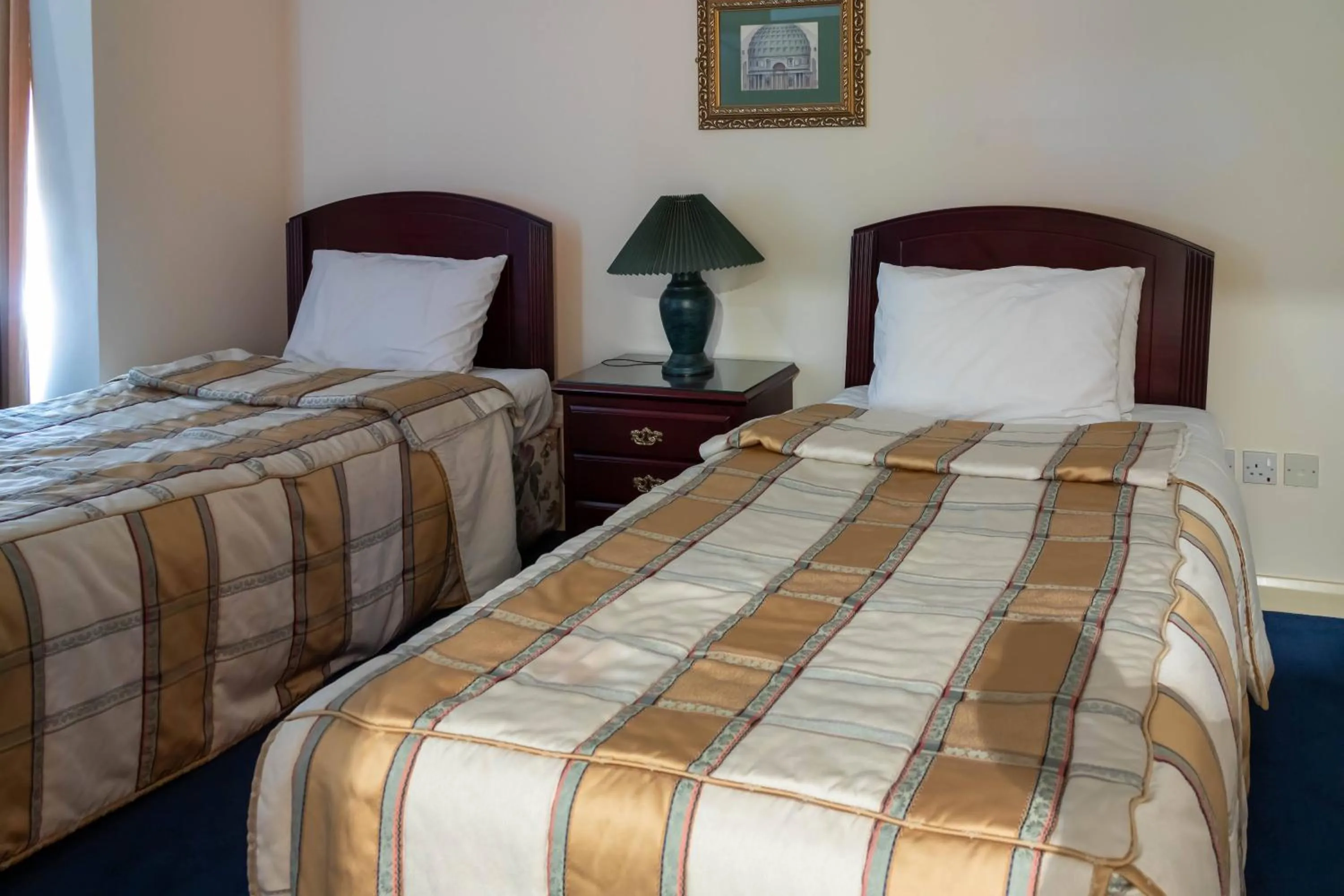 Bed in Mansouri Mansions Hotel