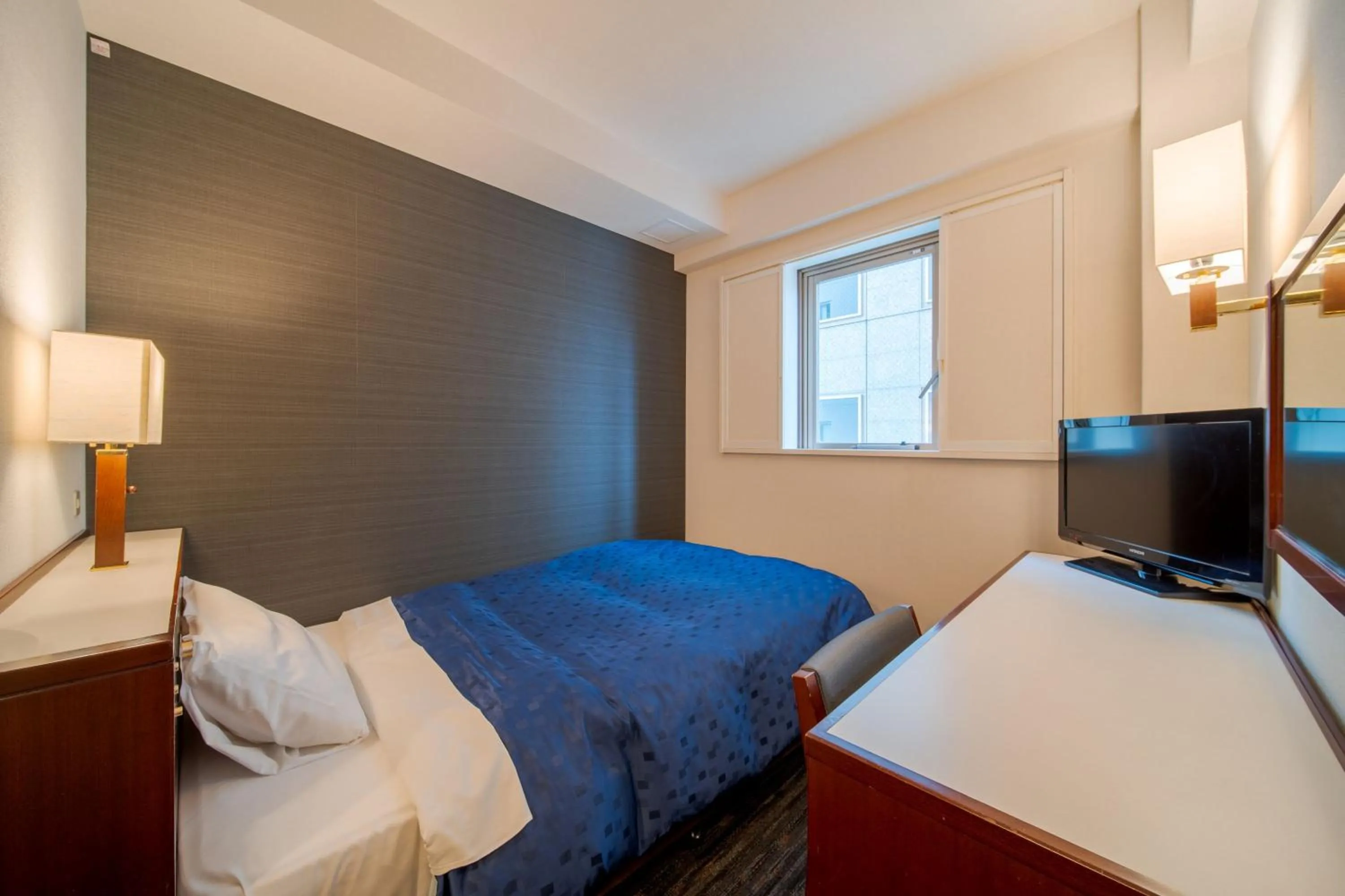 Communal lounge/ TV room, Bed in Meitetsu Inn Nagoya Ekimae