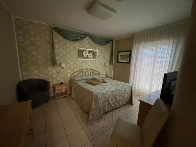 Bed in Hotel Acquario