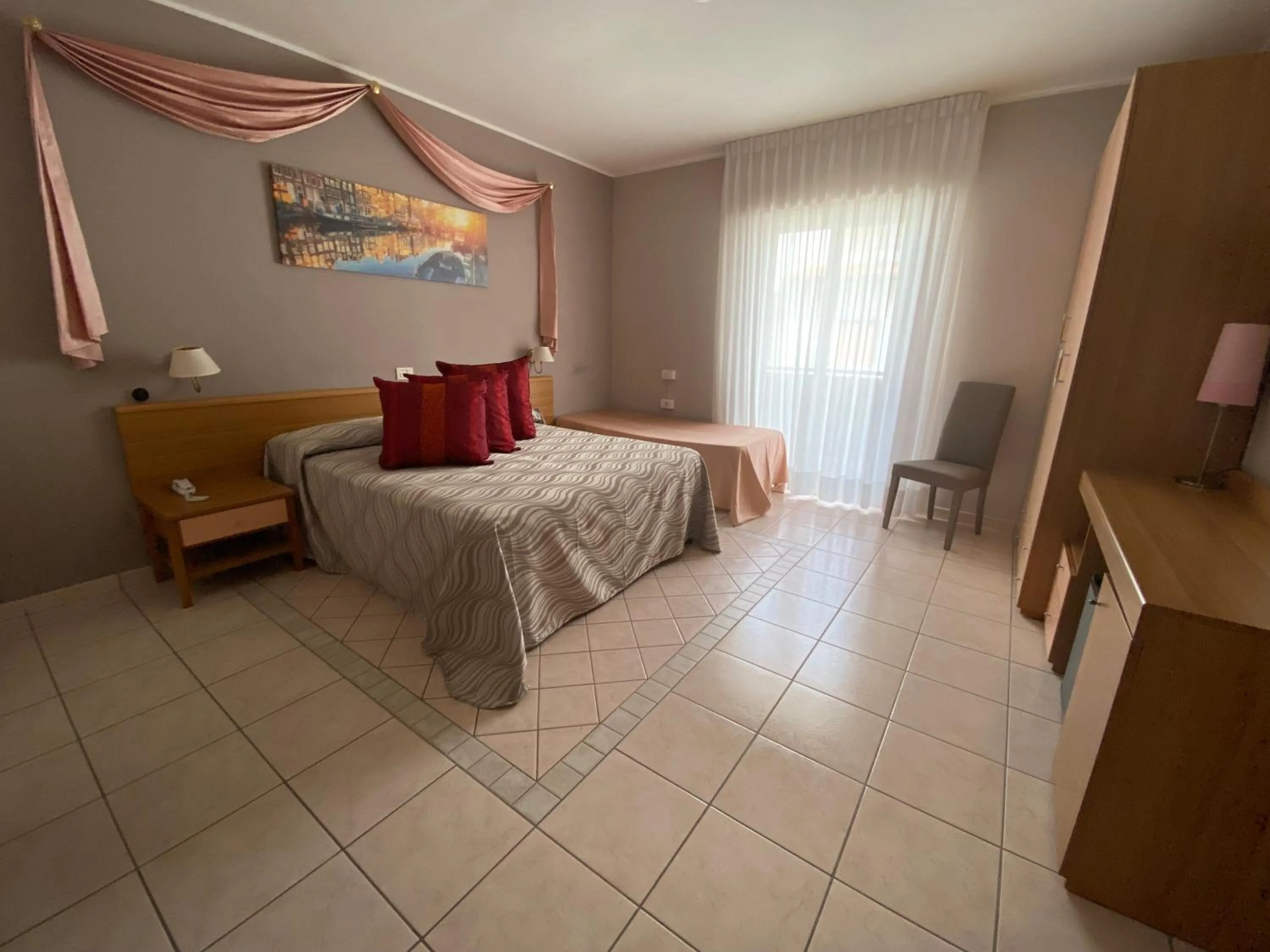 Bed in Hotel Acquario