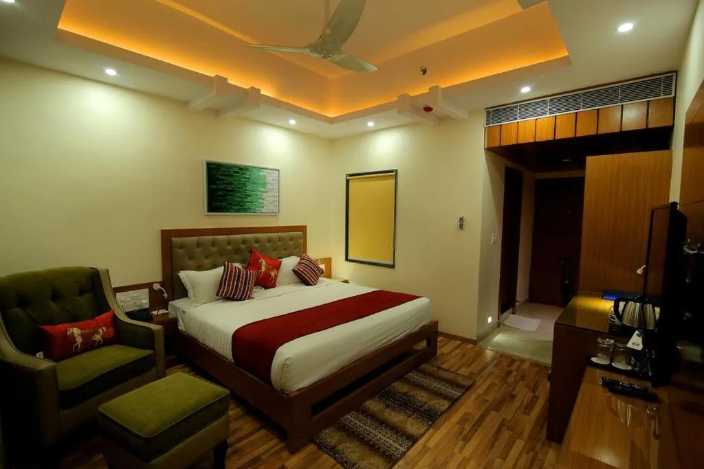 Photo of the whole room, Bed in Hotel Hampi International