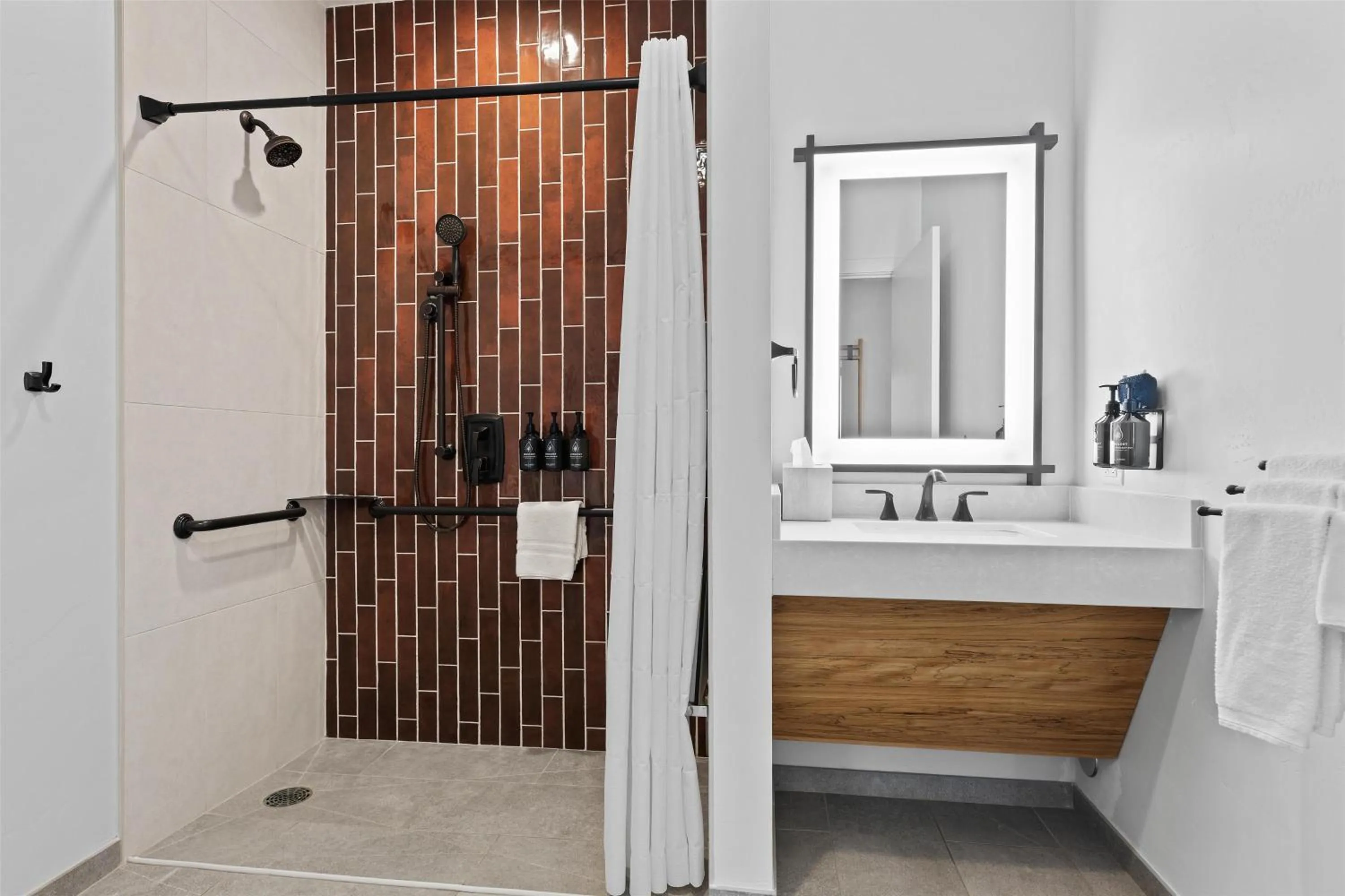 Bathroom in Hotel De Novo Springdale, Tapestry Collection by Hilton