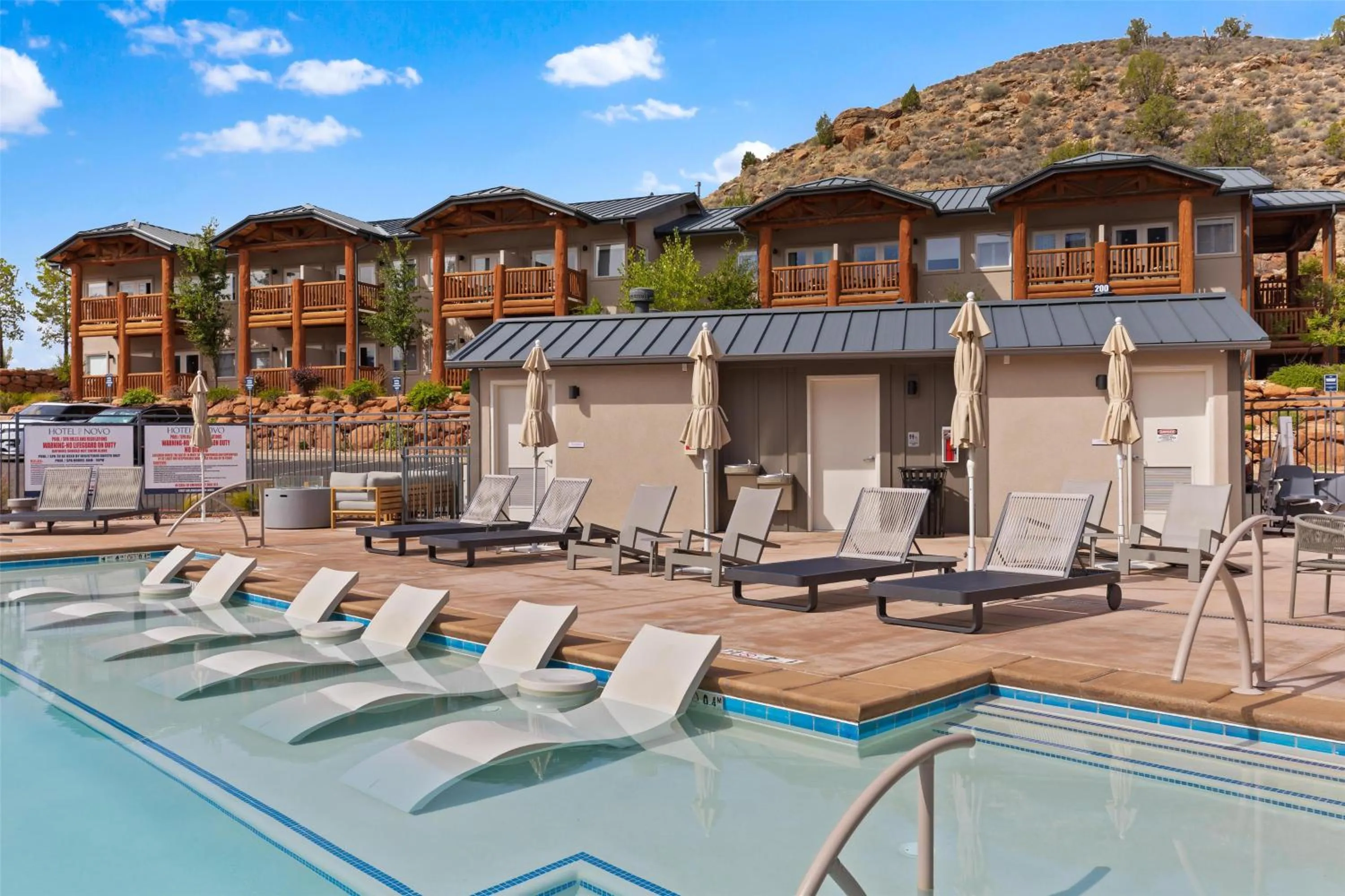 Pool view in Hotel De Novo Springdale, Tapestry Collection by Hilton