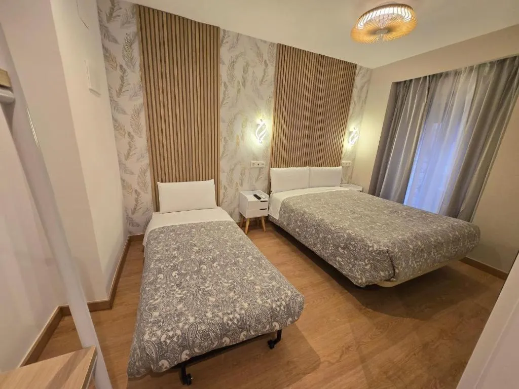 Bed in Hostal Comercial