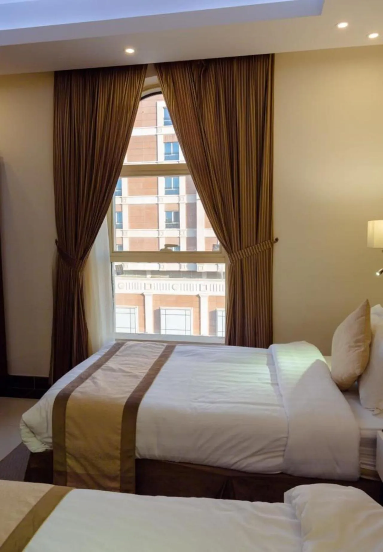 Bed in Sun Park Hotel Suites