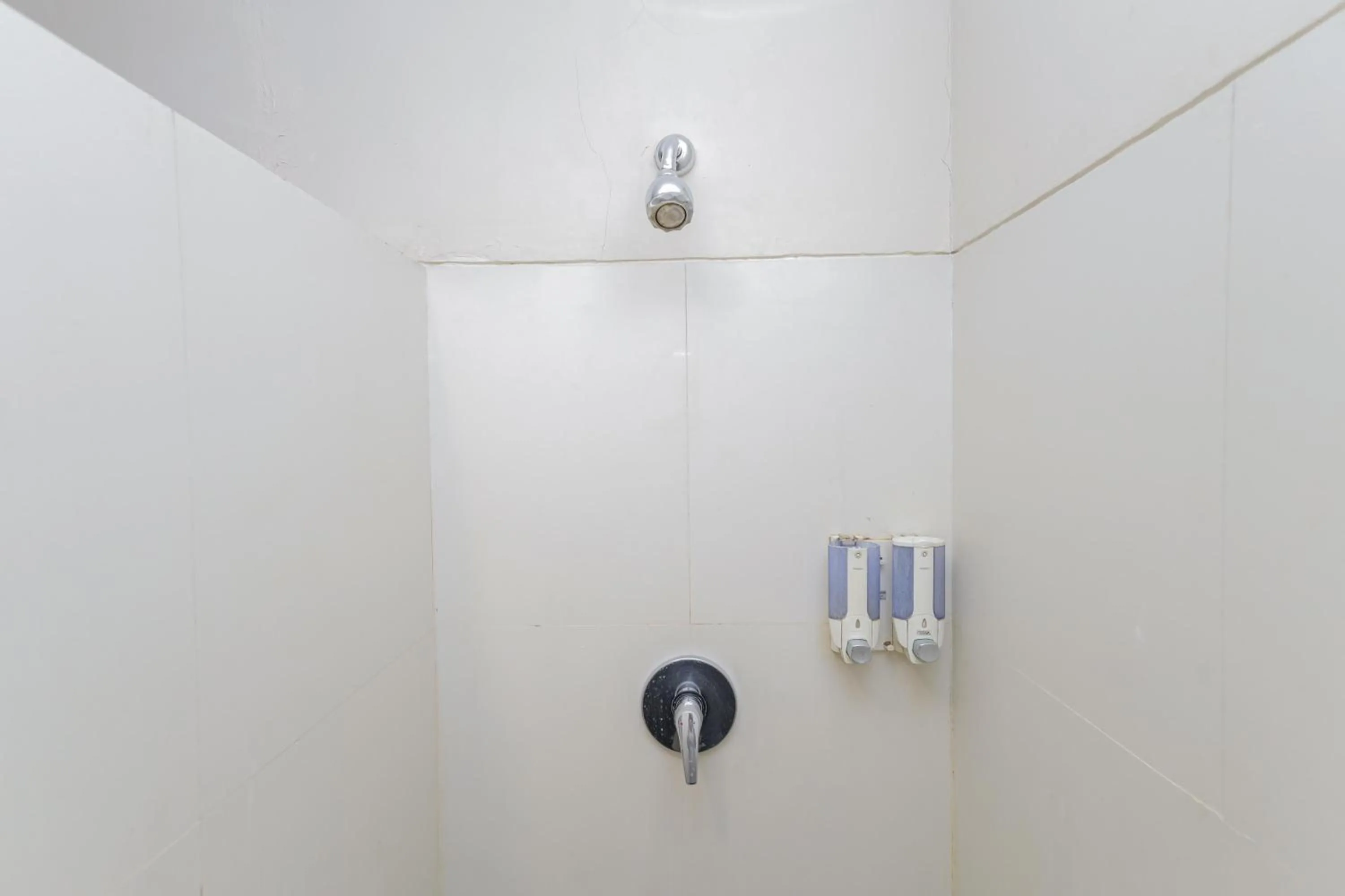 Bathroom in Urbanview Hotel Taman Suci Denpasar Bali