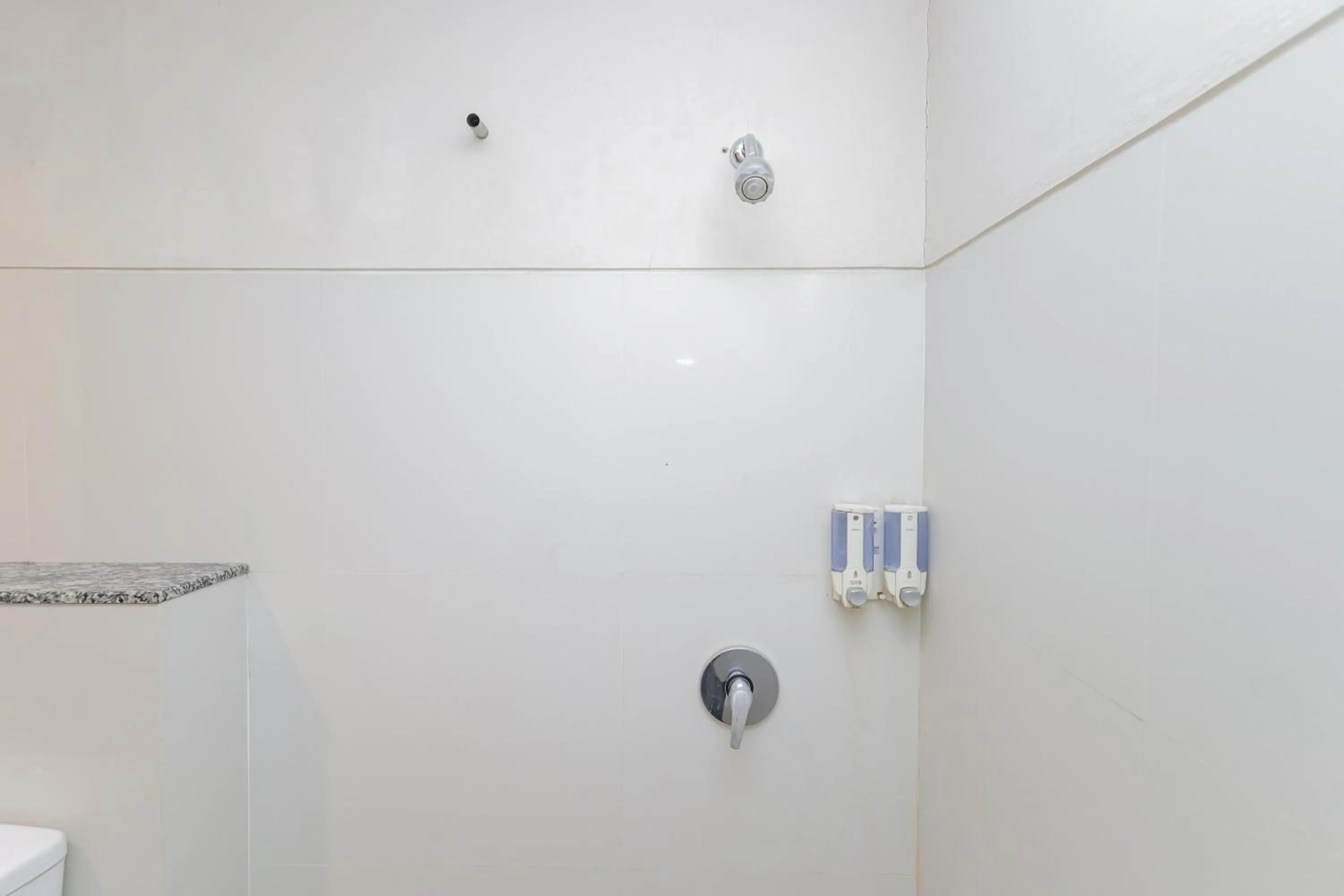 Bathroom in Urbanview Hotel Taman Suci Denpasar Bali