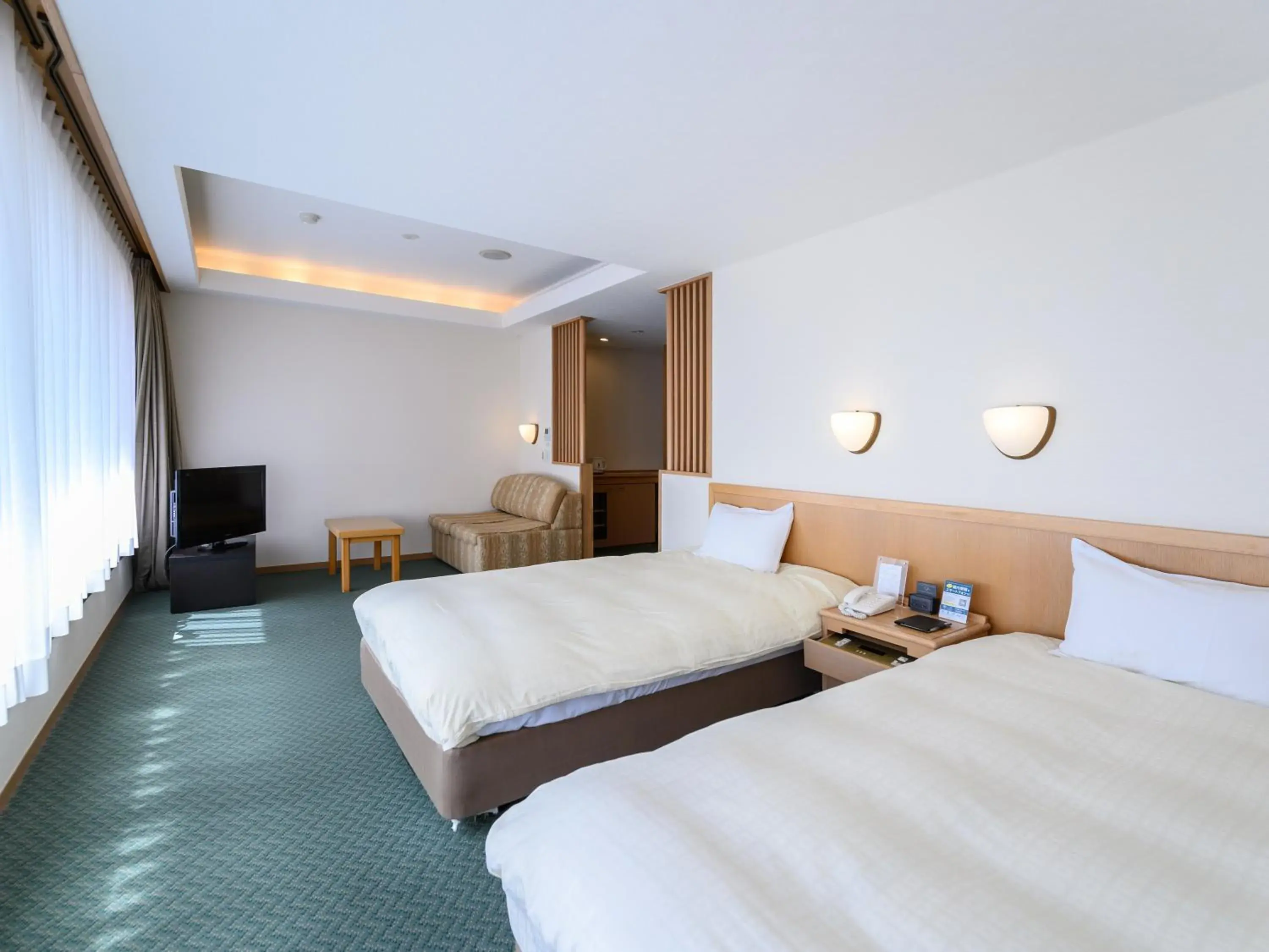 Bed in Nemu Resort Hotel Nemu Bed in Nemu Resort Hotel Nemu