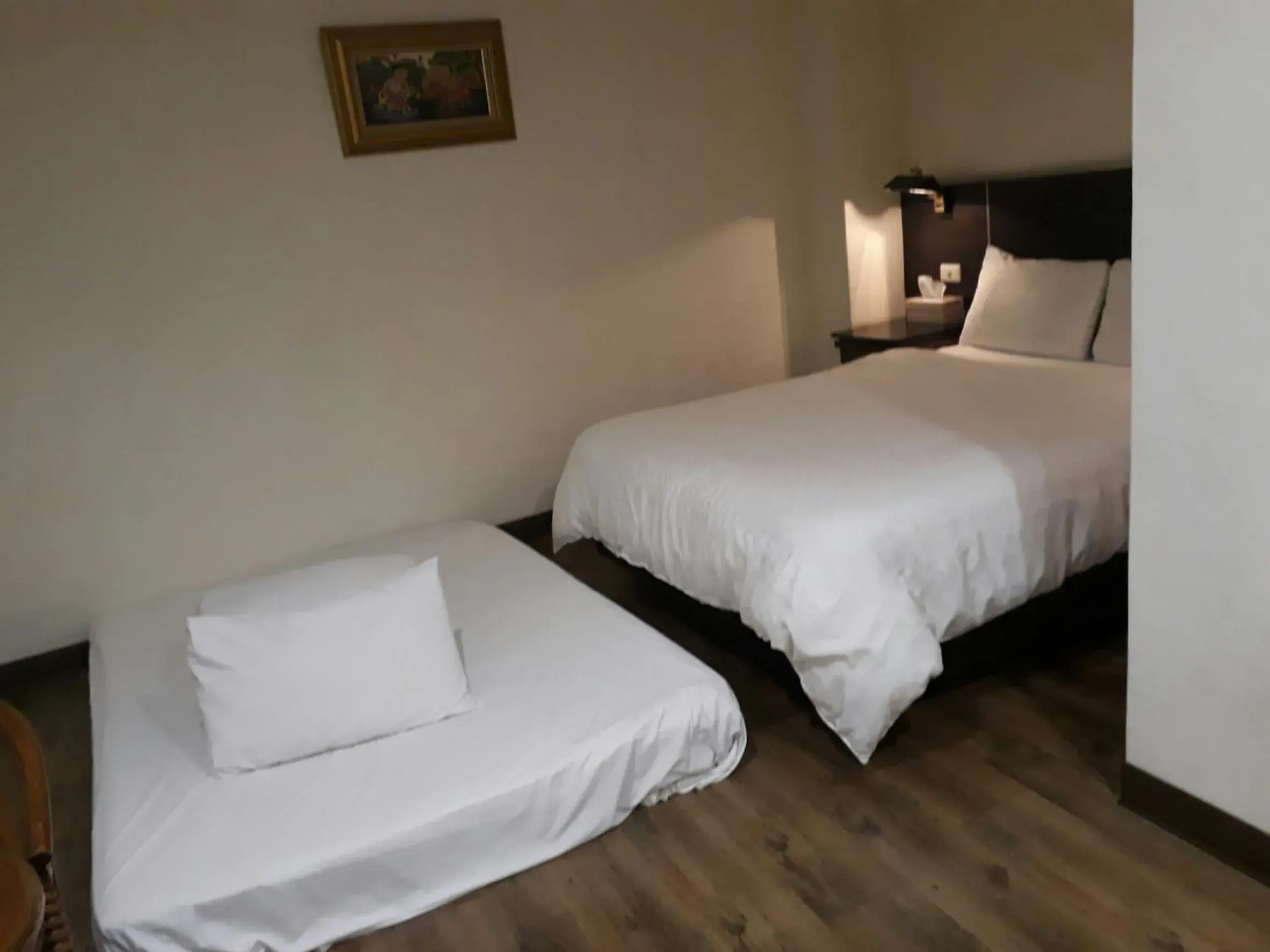 Bed in Hua Tai Hotel Bed in Hua Tai Hotel