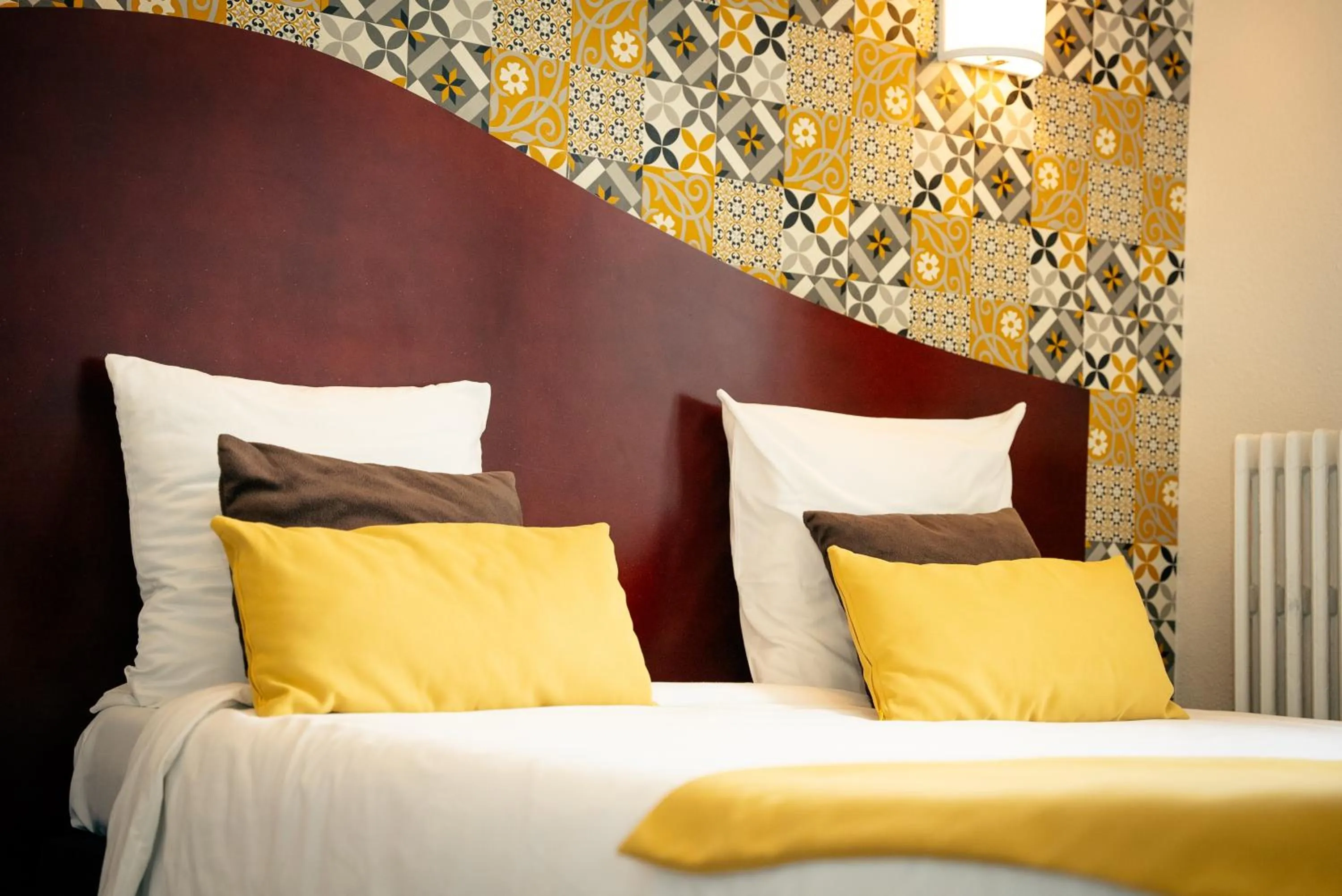 Bed in Hotel les Commercants