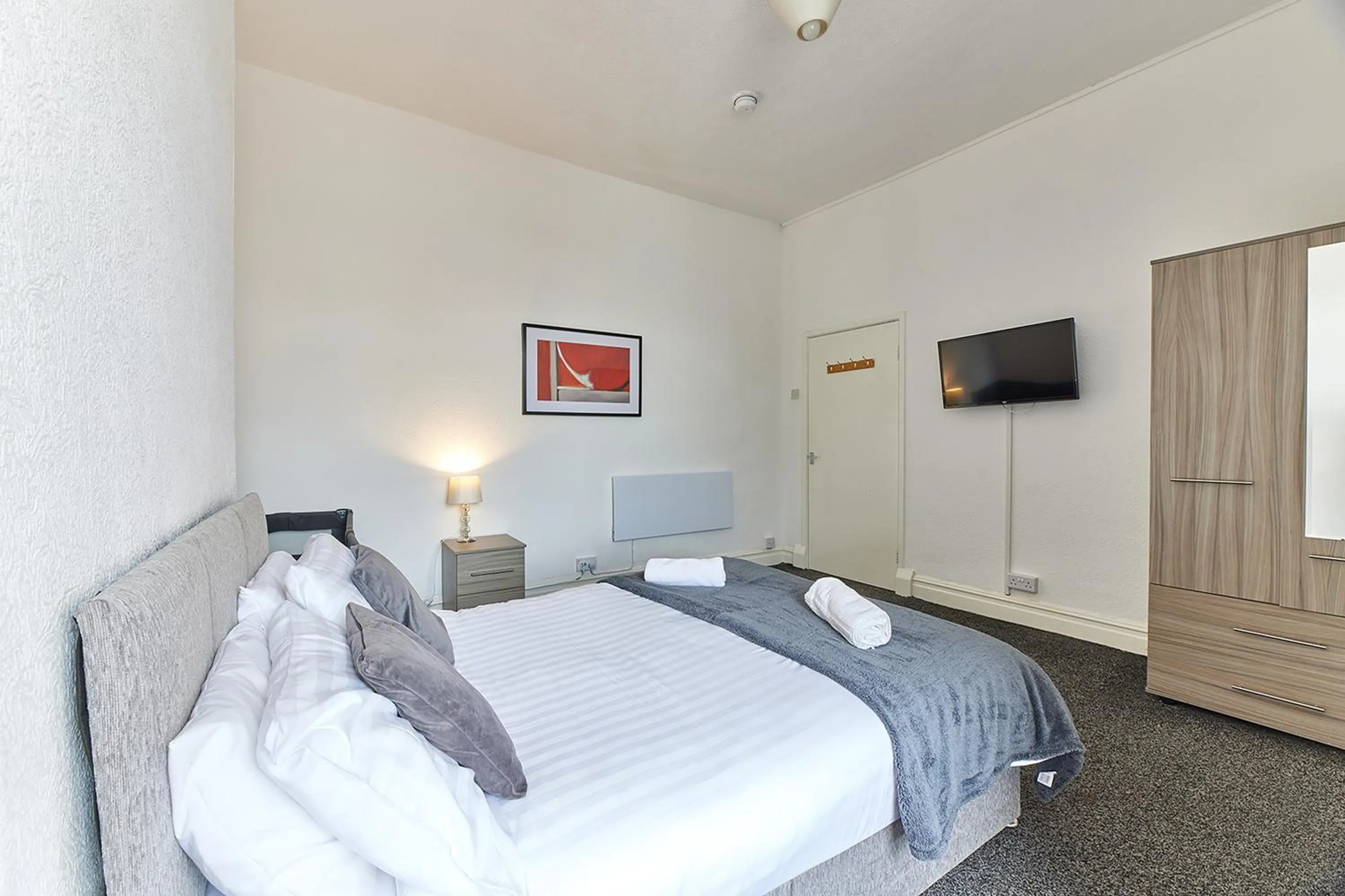 Bed in Pleasure Holiday Apartments