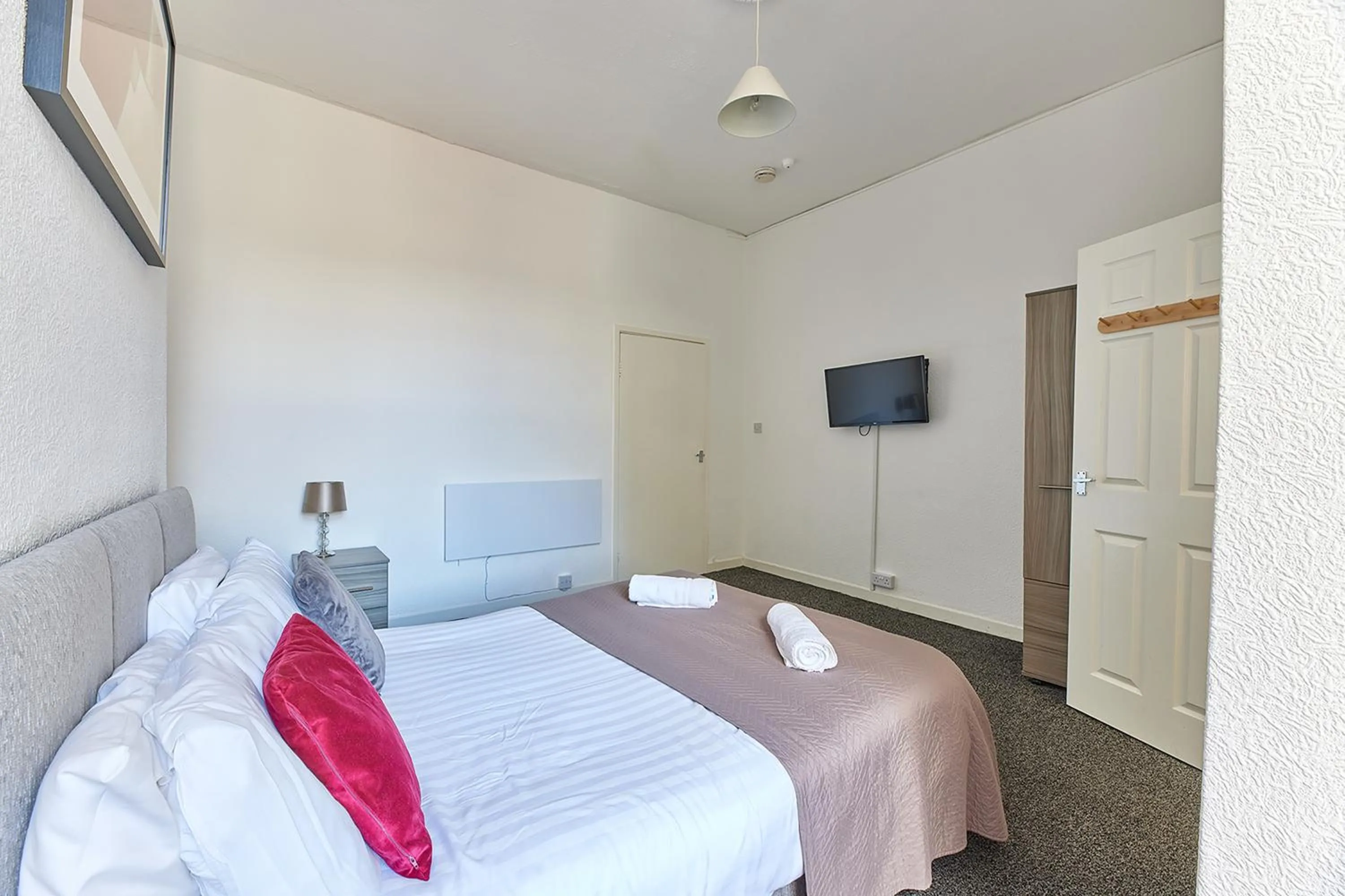 Bed in Pleasure Holiday Apartments