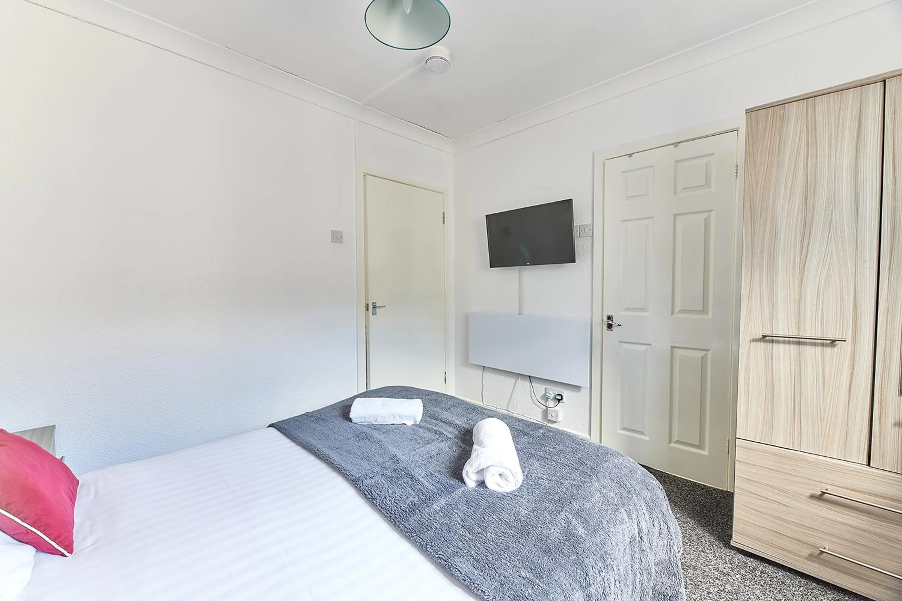 Bed in Pleasure Holiday Apartments