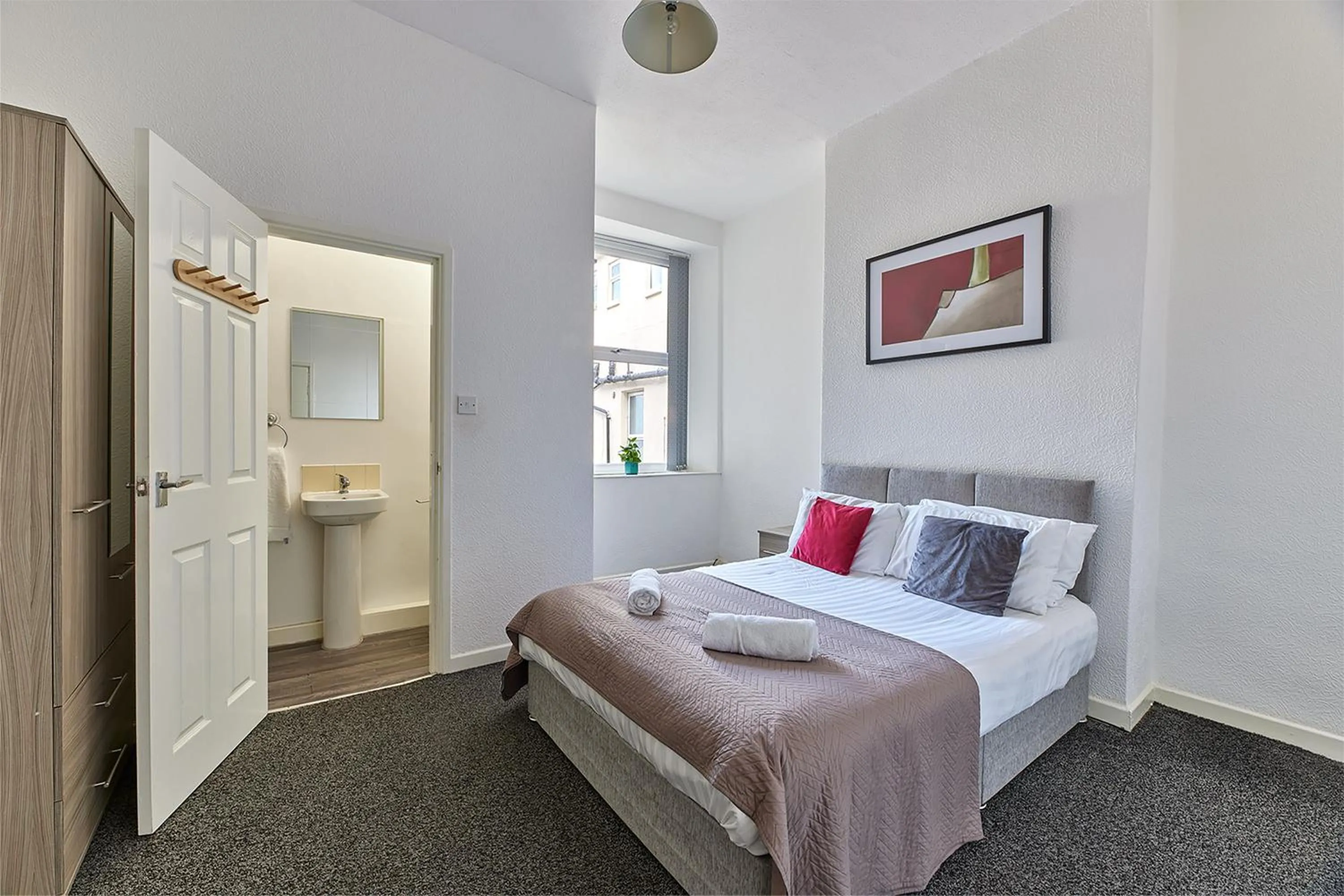 Bed in Pleasure Holiday Apartments