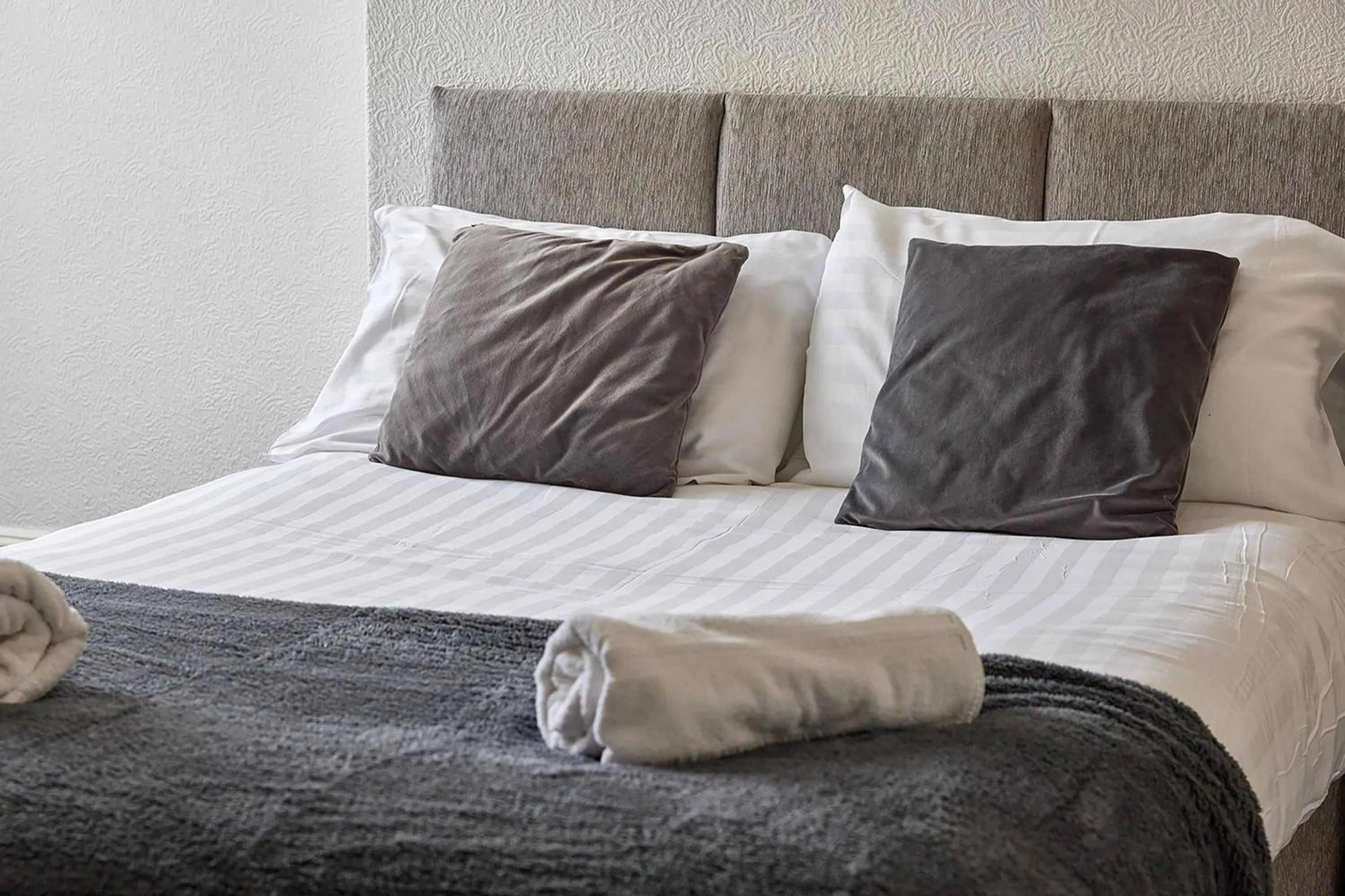 Bed in Pleasure Holiday Apartments