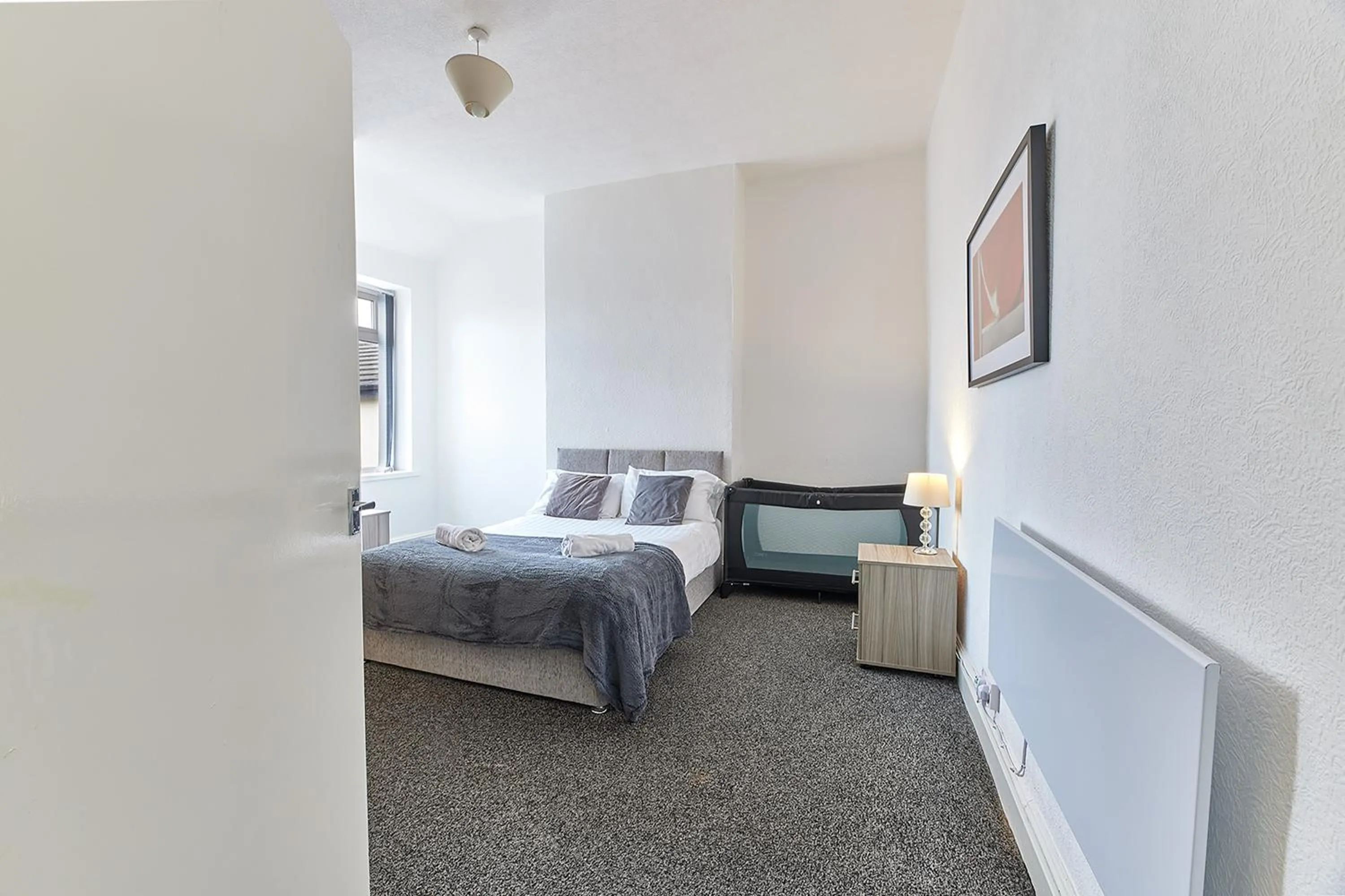 Bed in Pleasure Holiday Apartments