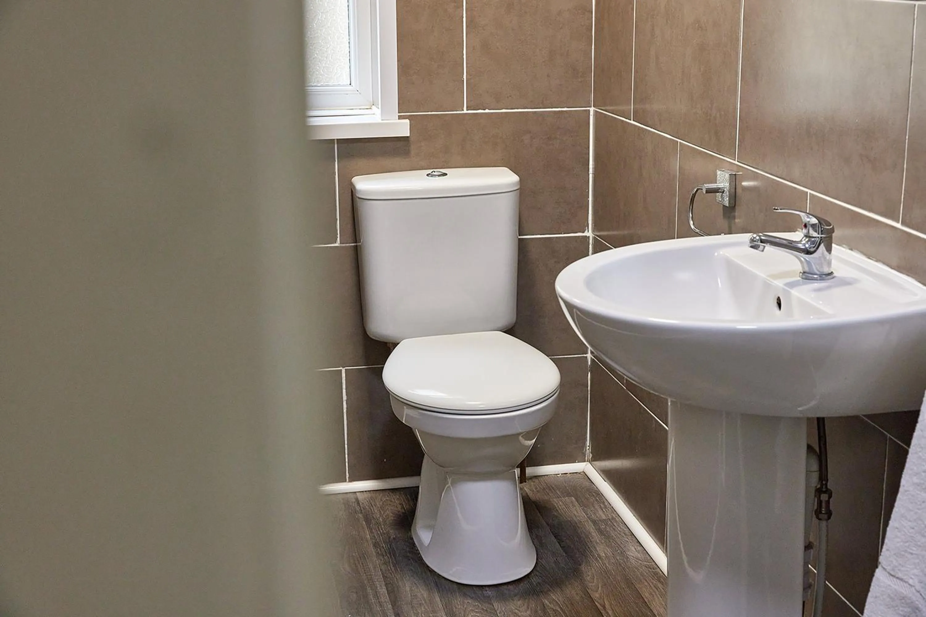 Toilet in Pleasure Holiday Apartments