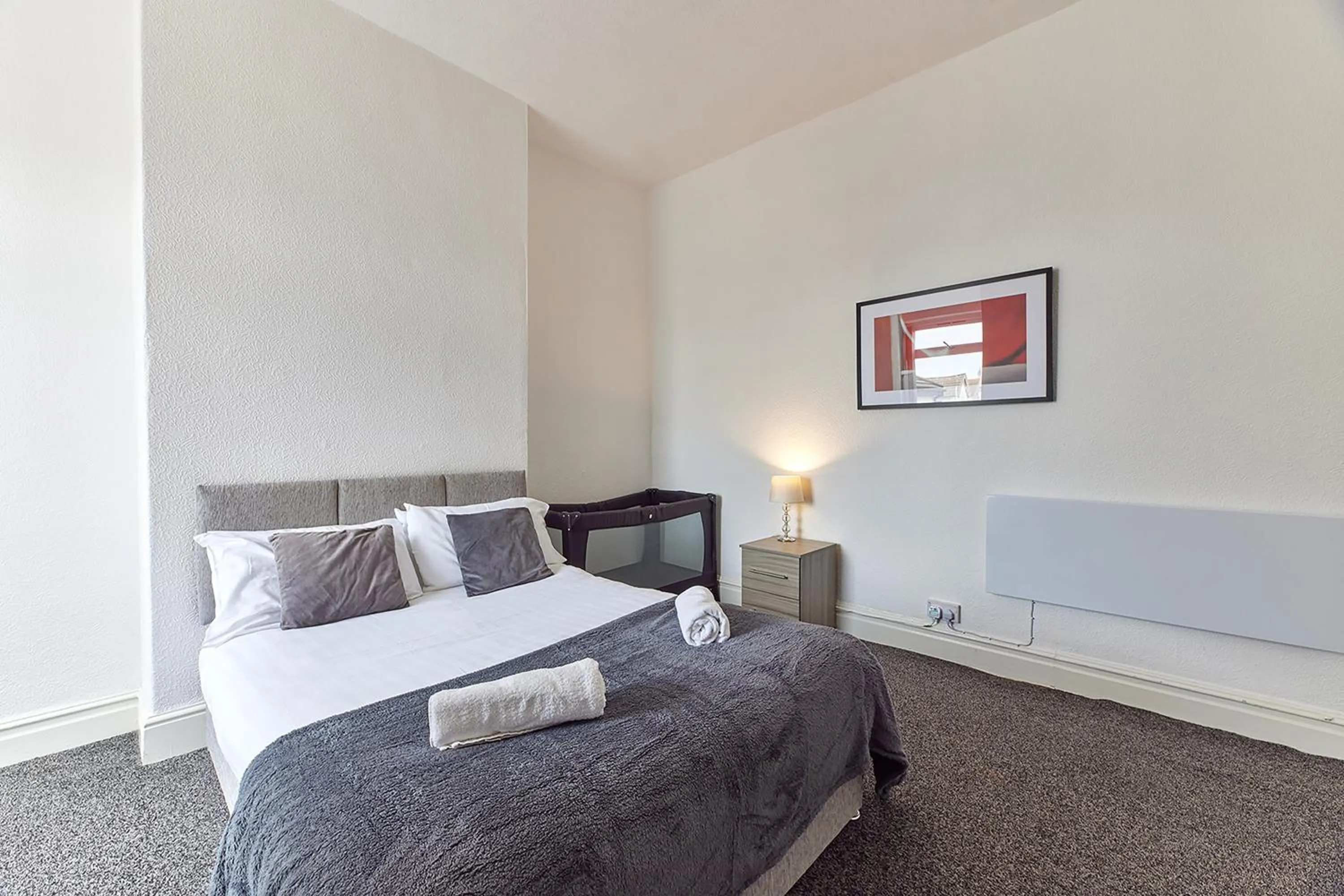 Bed in Pleasure Holiday Apartments