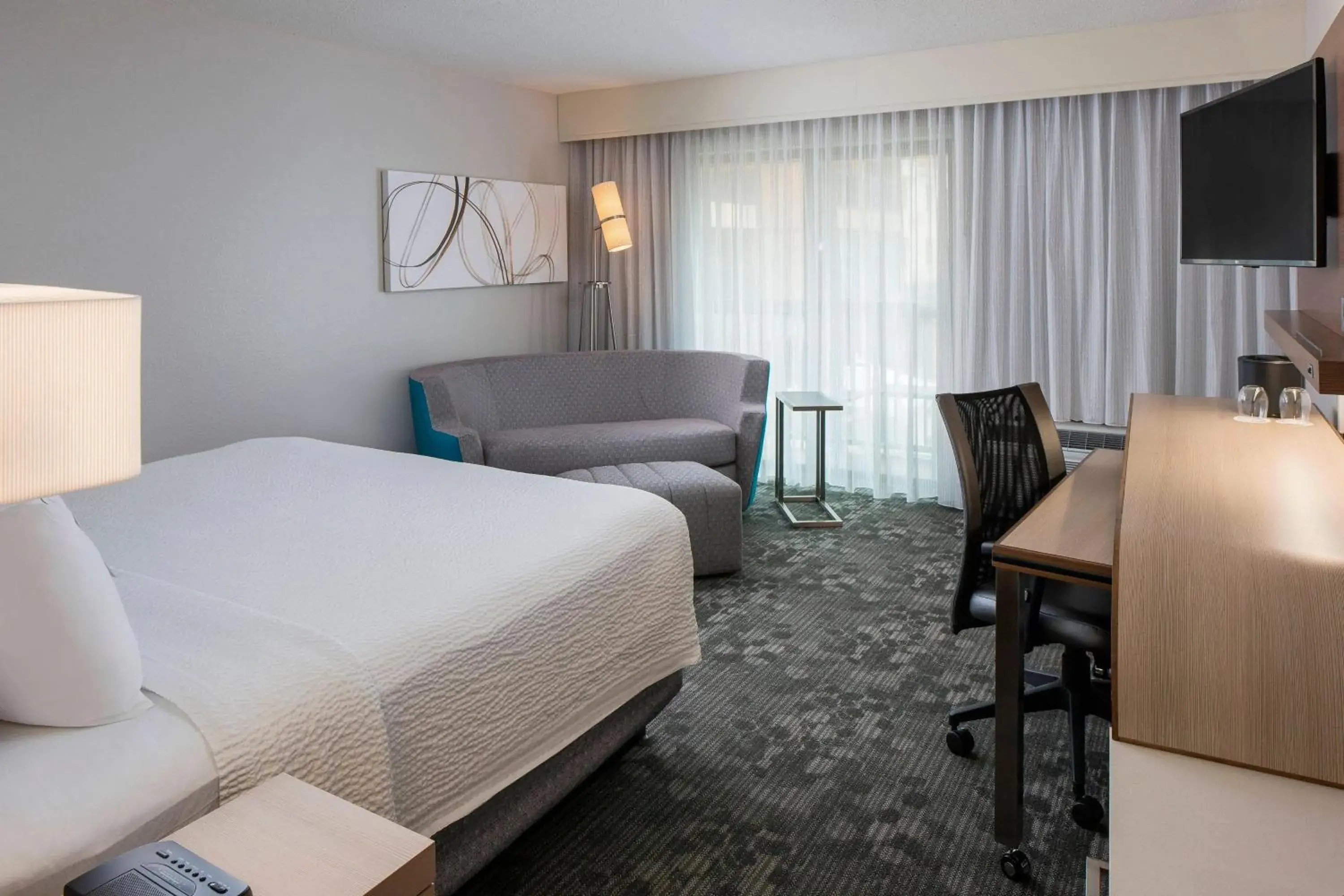 King Room with Sofa Bed and Roll-in Shower - Mobility Accessible in Courtyard by Marriott Daytona Beach Speedway/Airport King Room with Sofa Bed and Roll-in Shower - Mobility Accessible in Courtyard by Marriott Daytona Beach Speedway/Airport