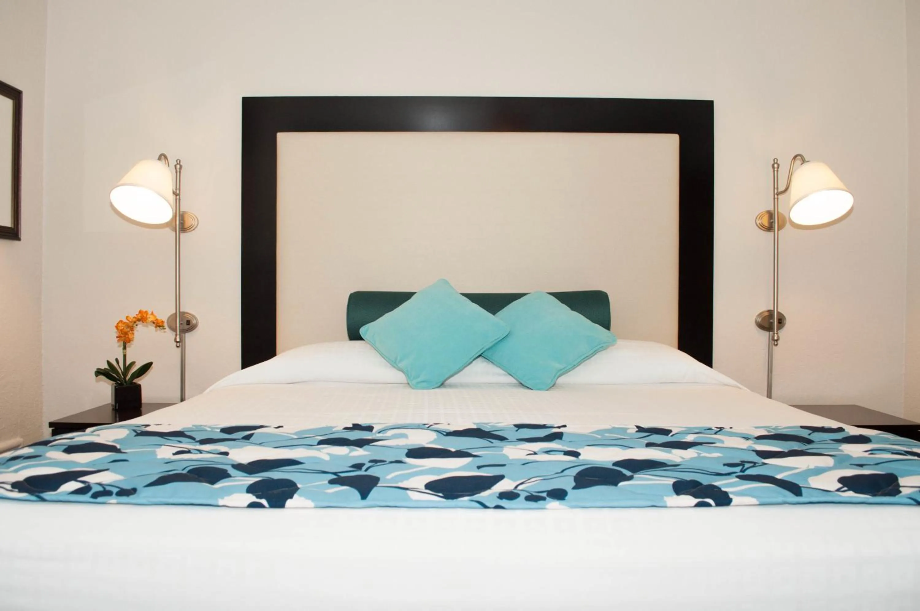 Bed in Laguna Shores Studio Suites