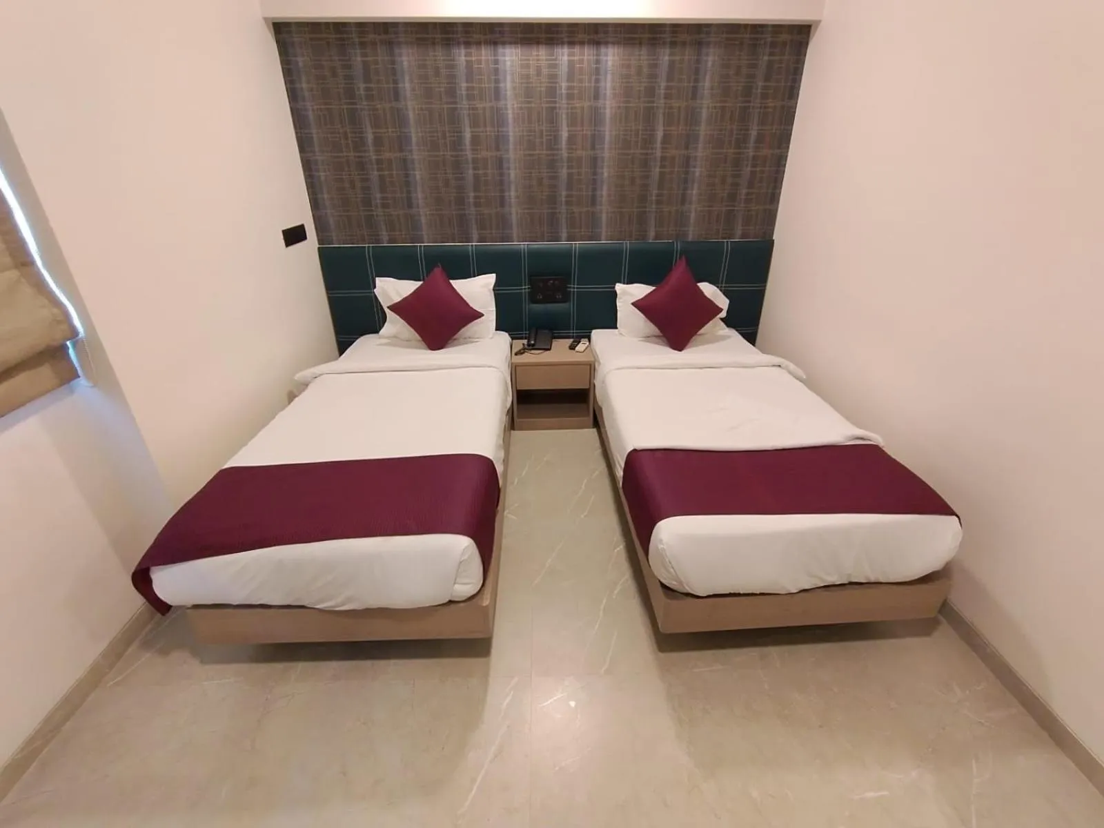 Bed in J Hotel and Banquets