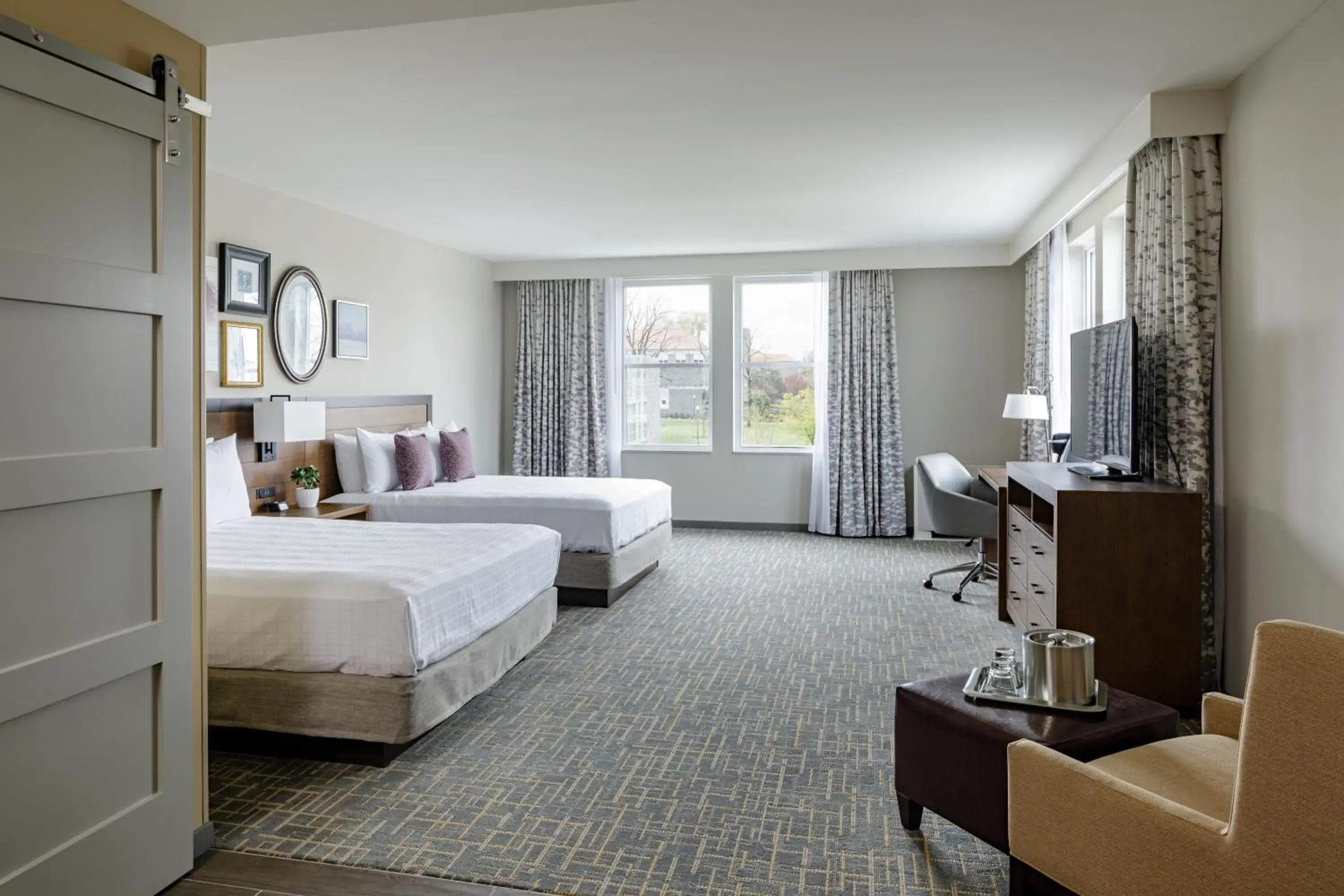 Seating area, Bed in Hotel Madison & Shenandoah Conference Ctr. Seating area, Bed in Hotel Madison & Shenandoah Conference Ctr.