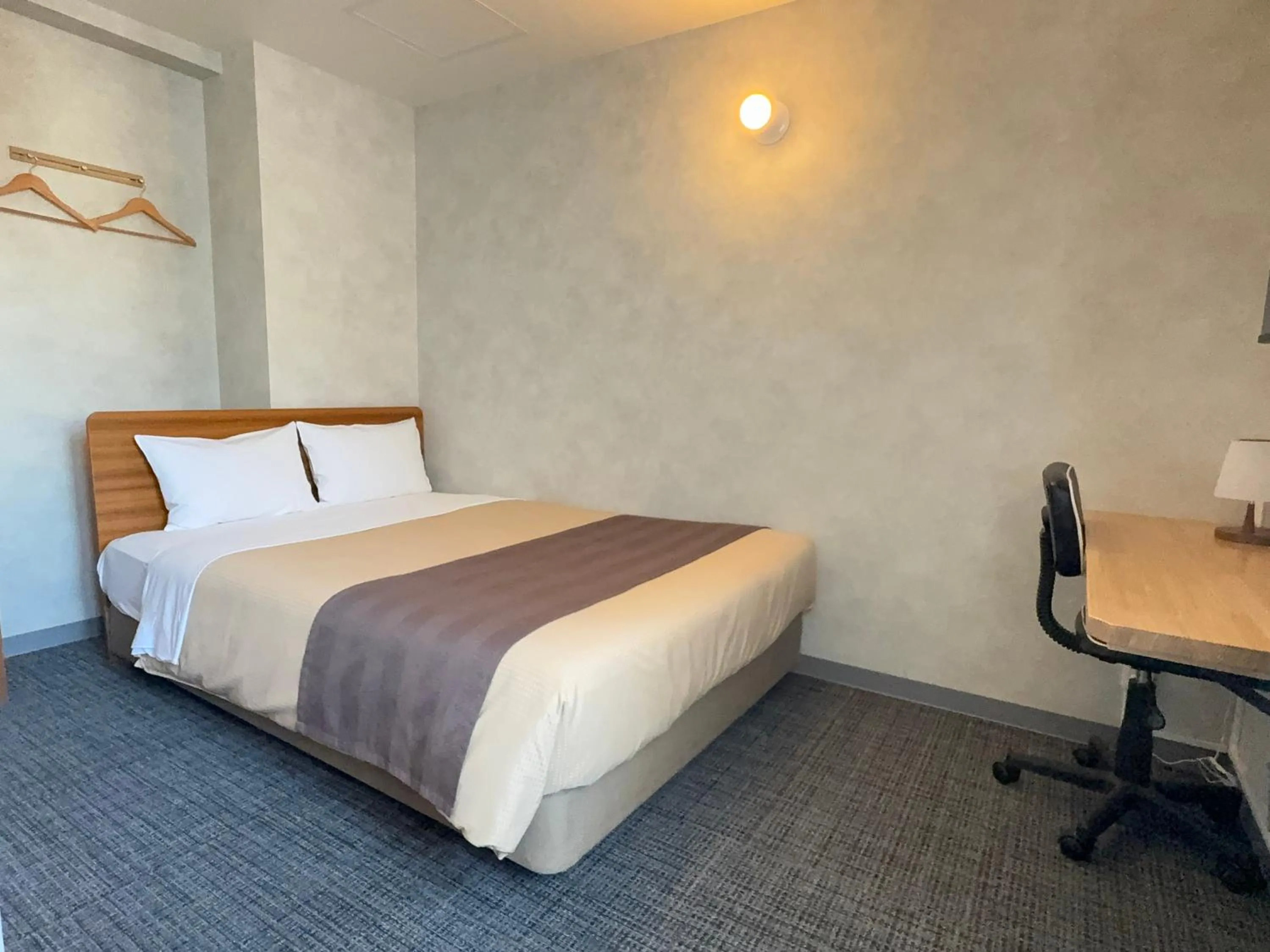 Bed in Tokyo Ueno New Izu Hotel