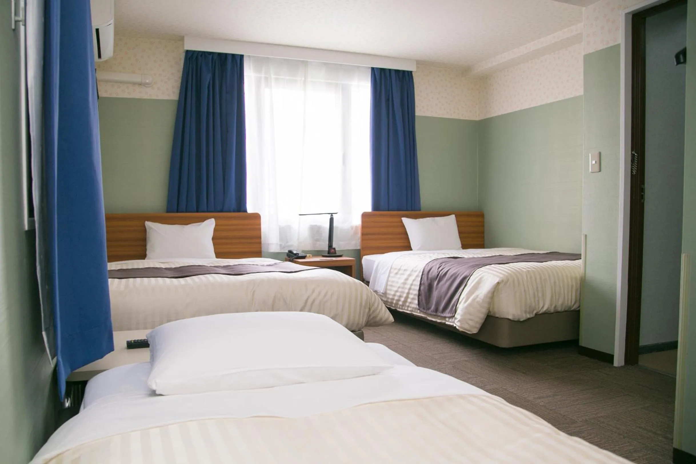 Bed in Tokyo Ueno New Izu Hotel