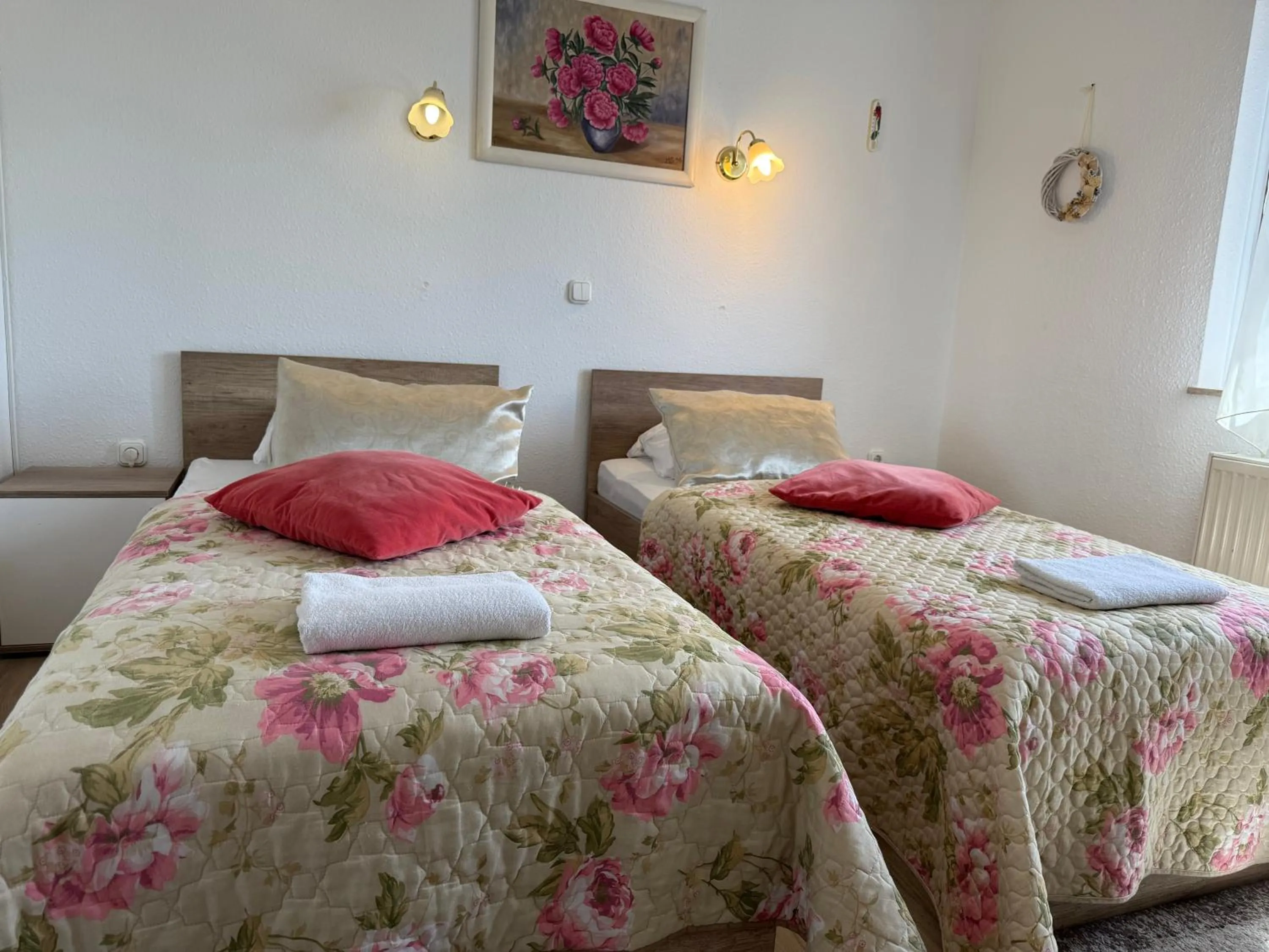 Bed in Le Rose Suites & Park Hotel