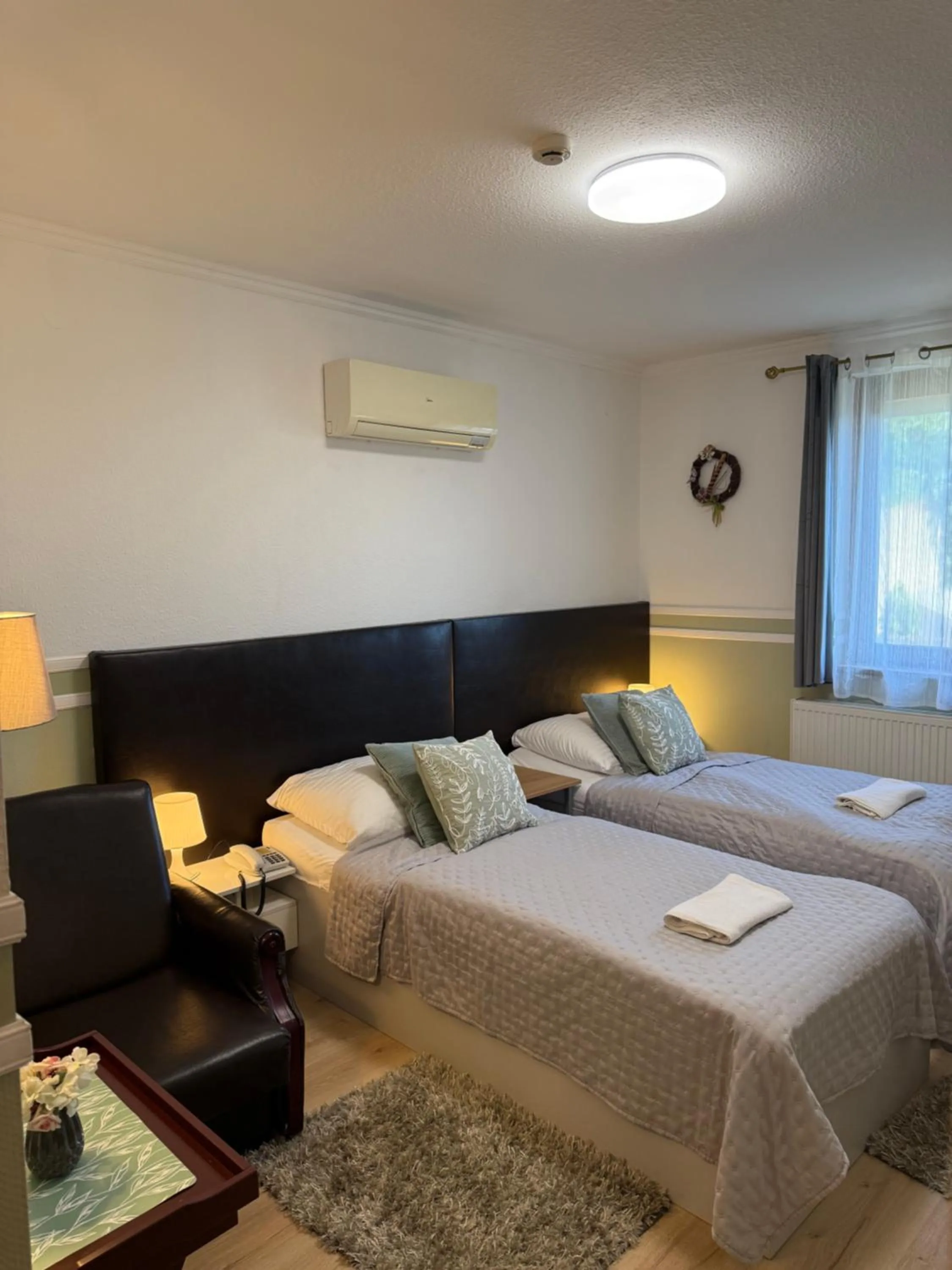 Bed in Le Rose Suites & Park Hotel