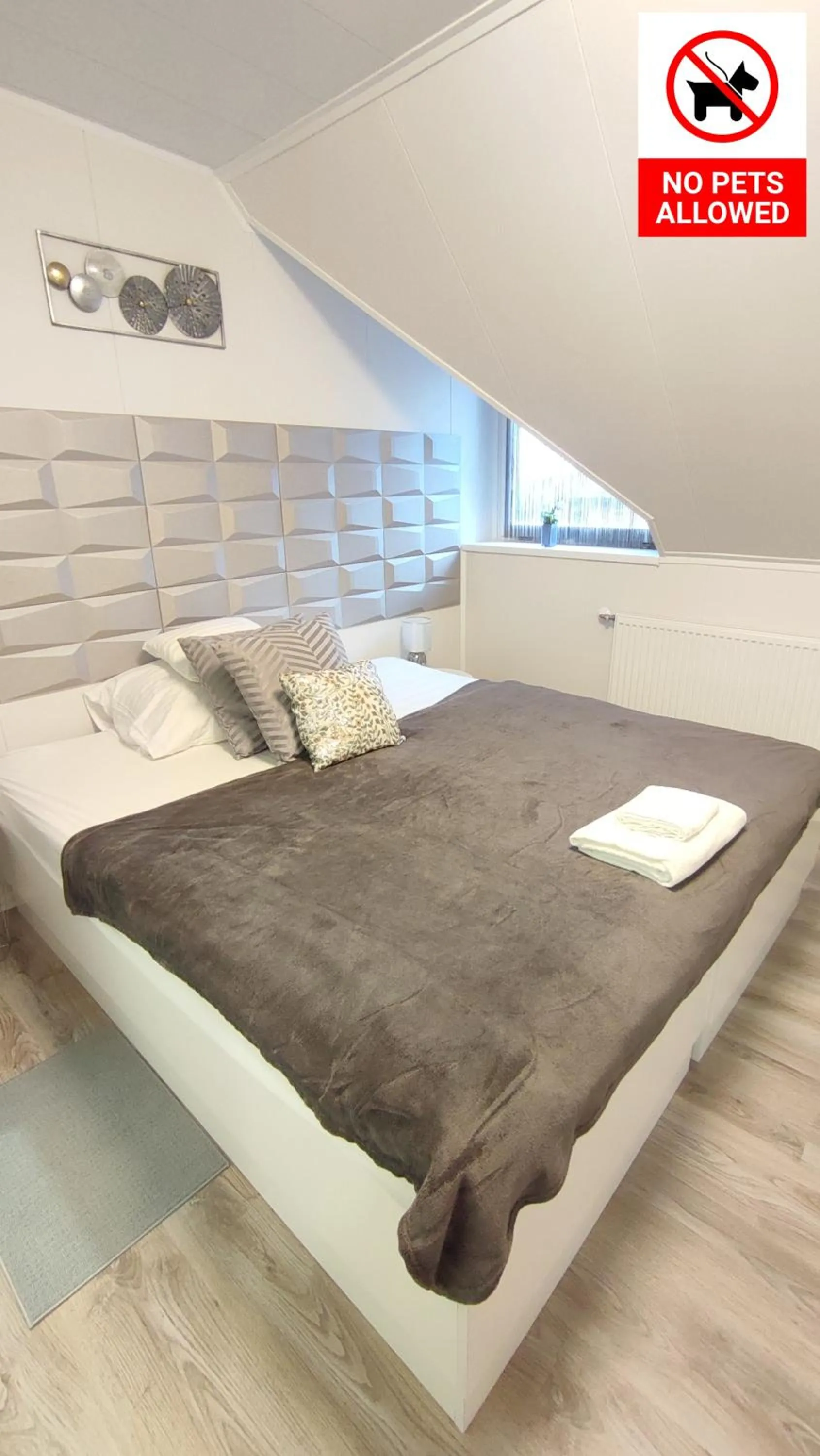 Bed in Le Rose Suites & Park Hotel