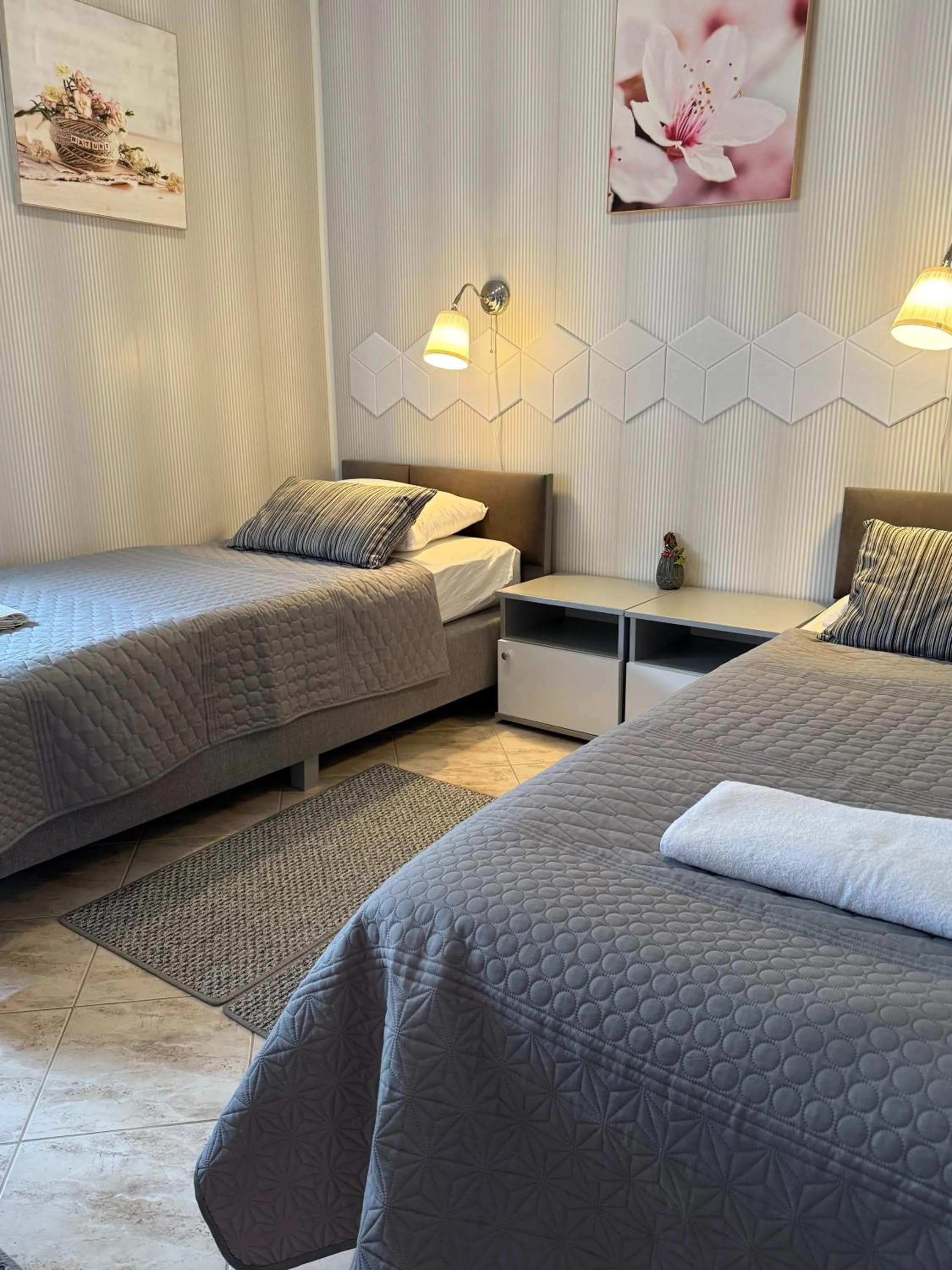 Bed in Le Rose Suites & Park Hotel