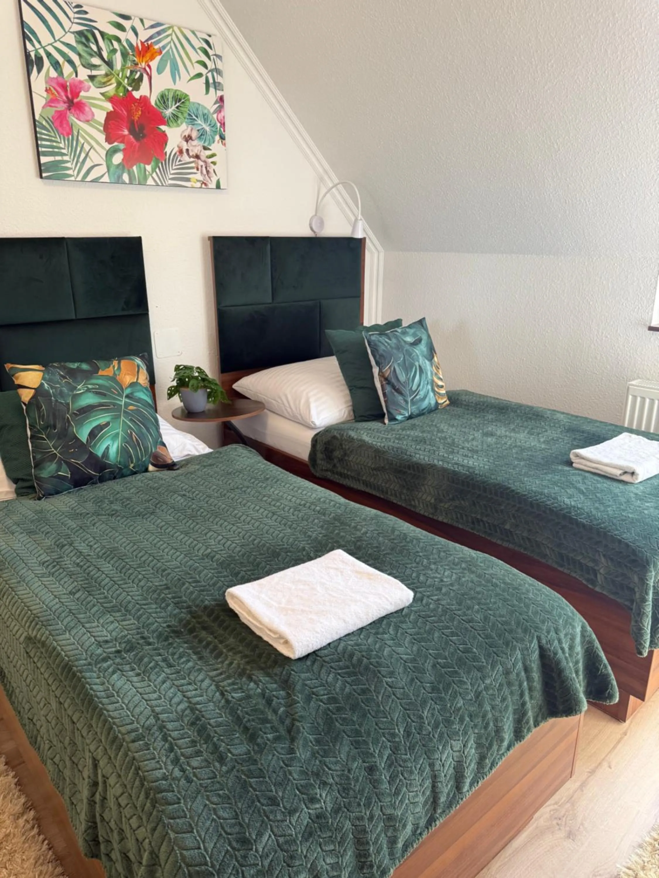 Bed in Le Rose Suites & Park Hotel