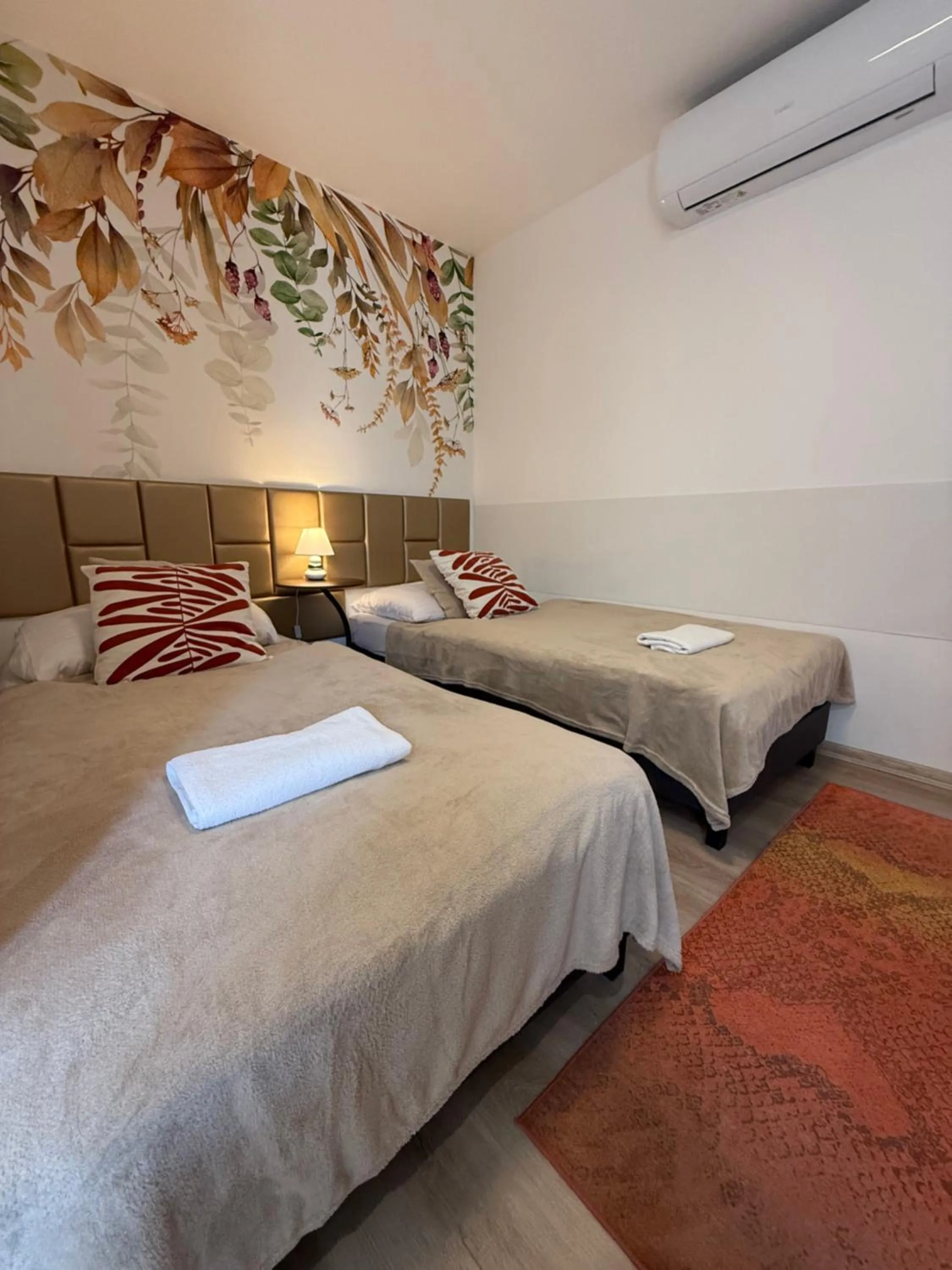 Bed in Le Rose Suites & Park Hotel