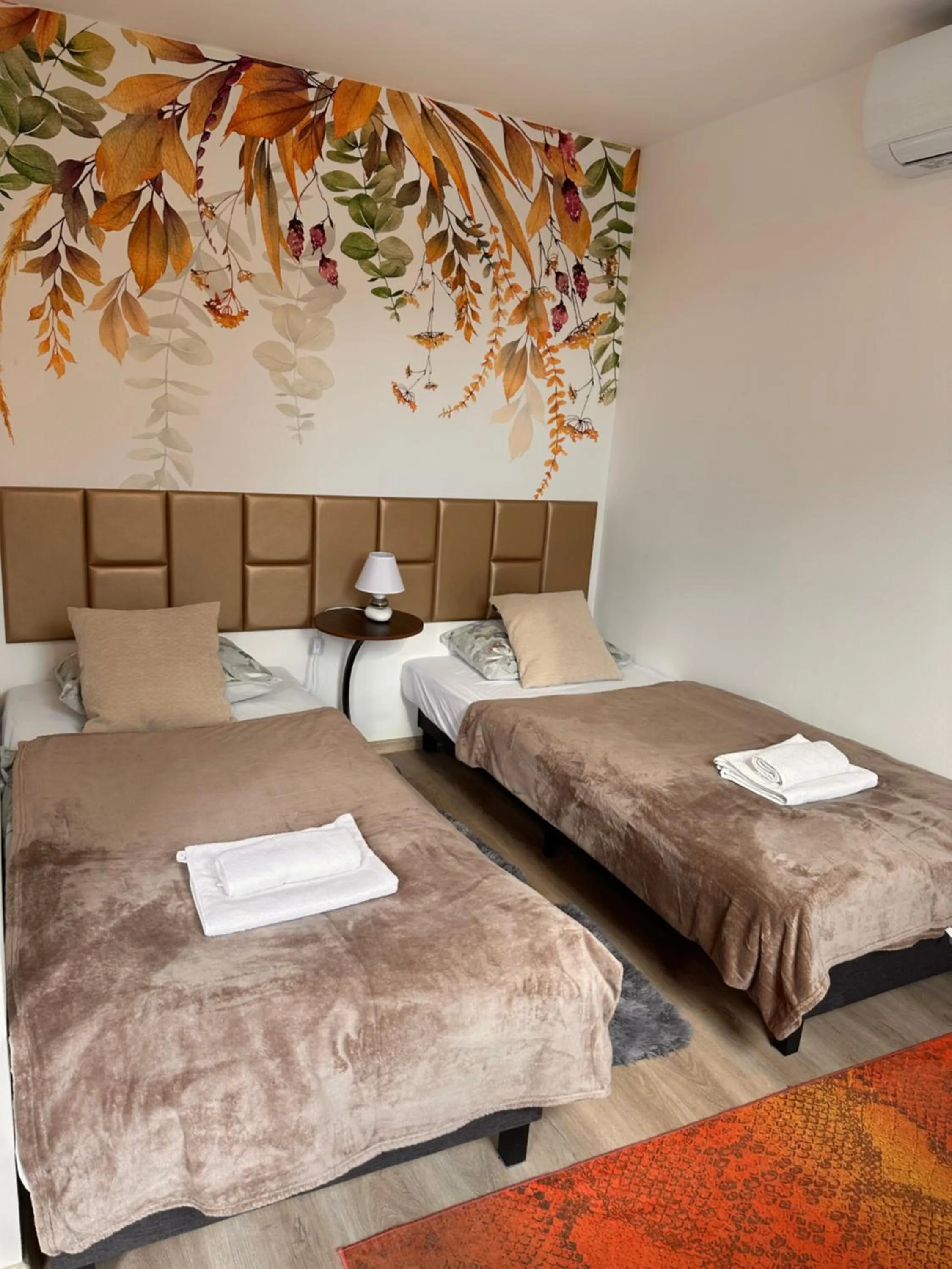 Bed in Le Rose Suites & Park Hotel