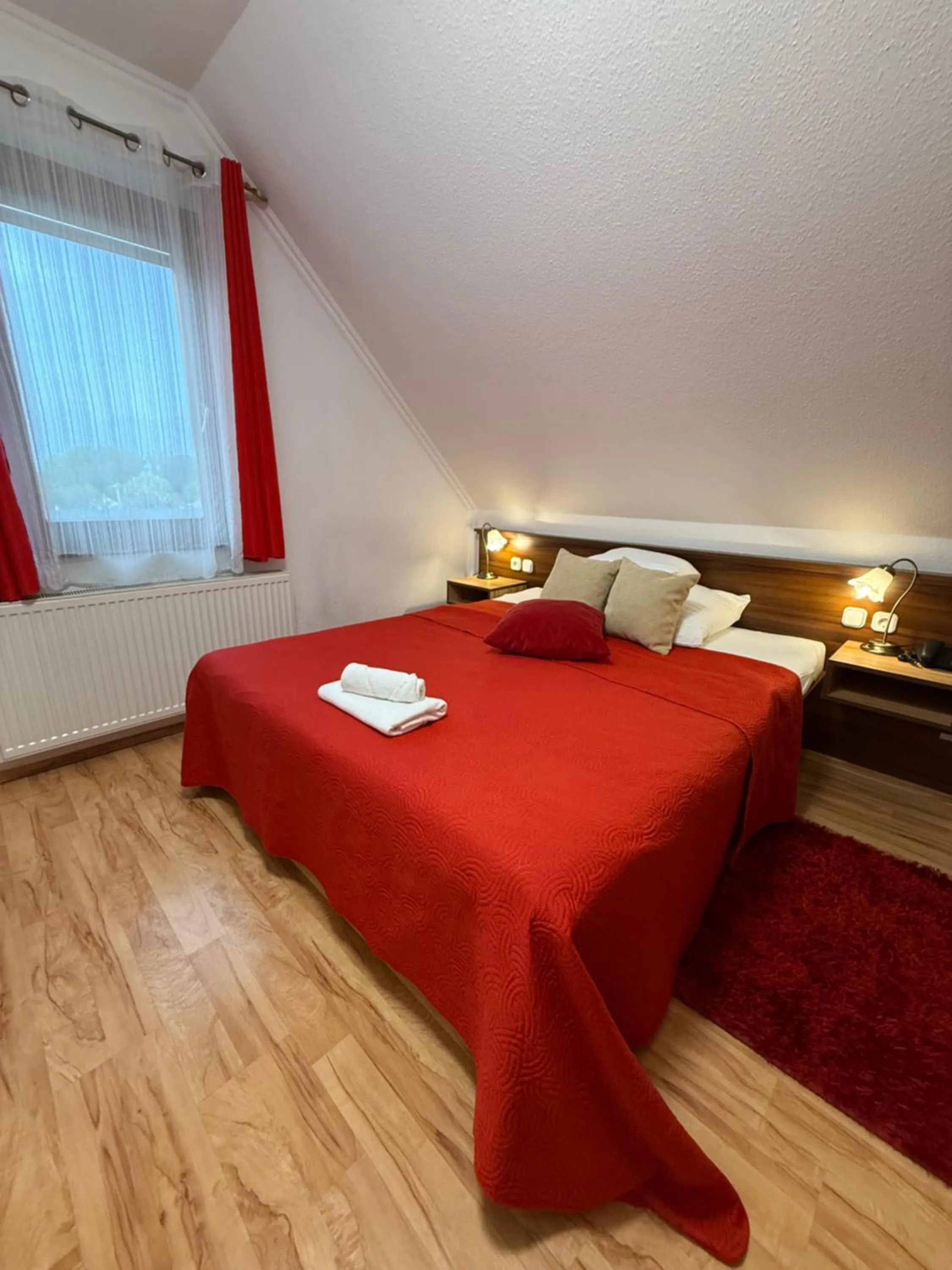 Bed in Le Rose Suites & Park Hotel