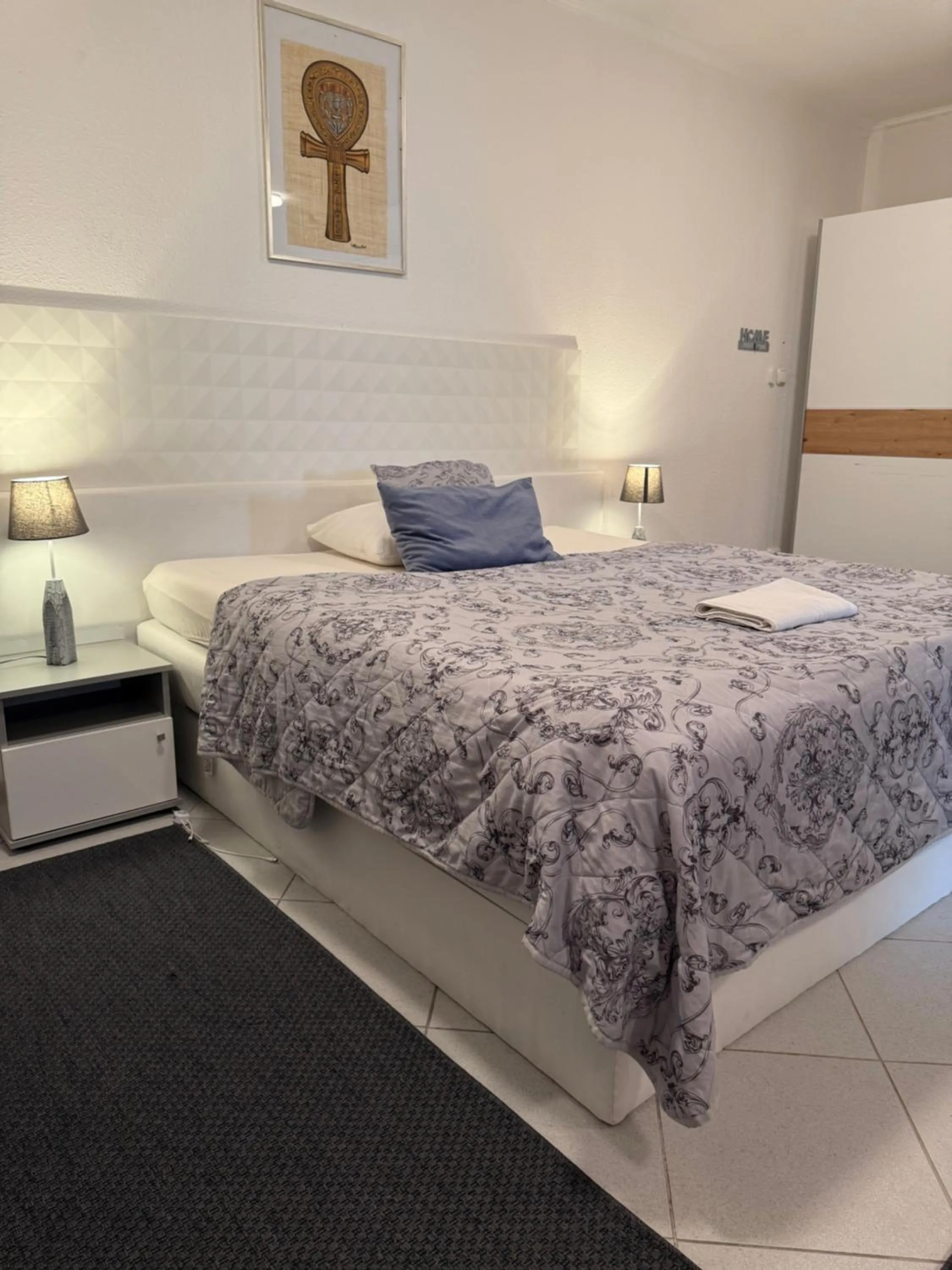 Bed in Le Rose Suites & Park Hotel