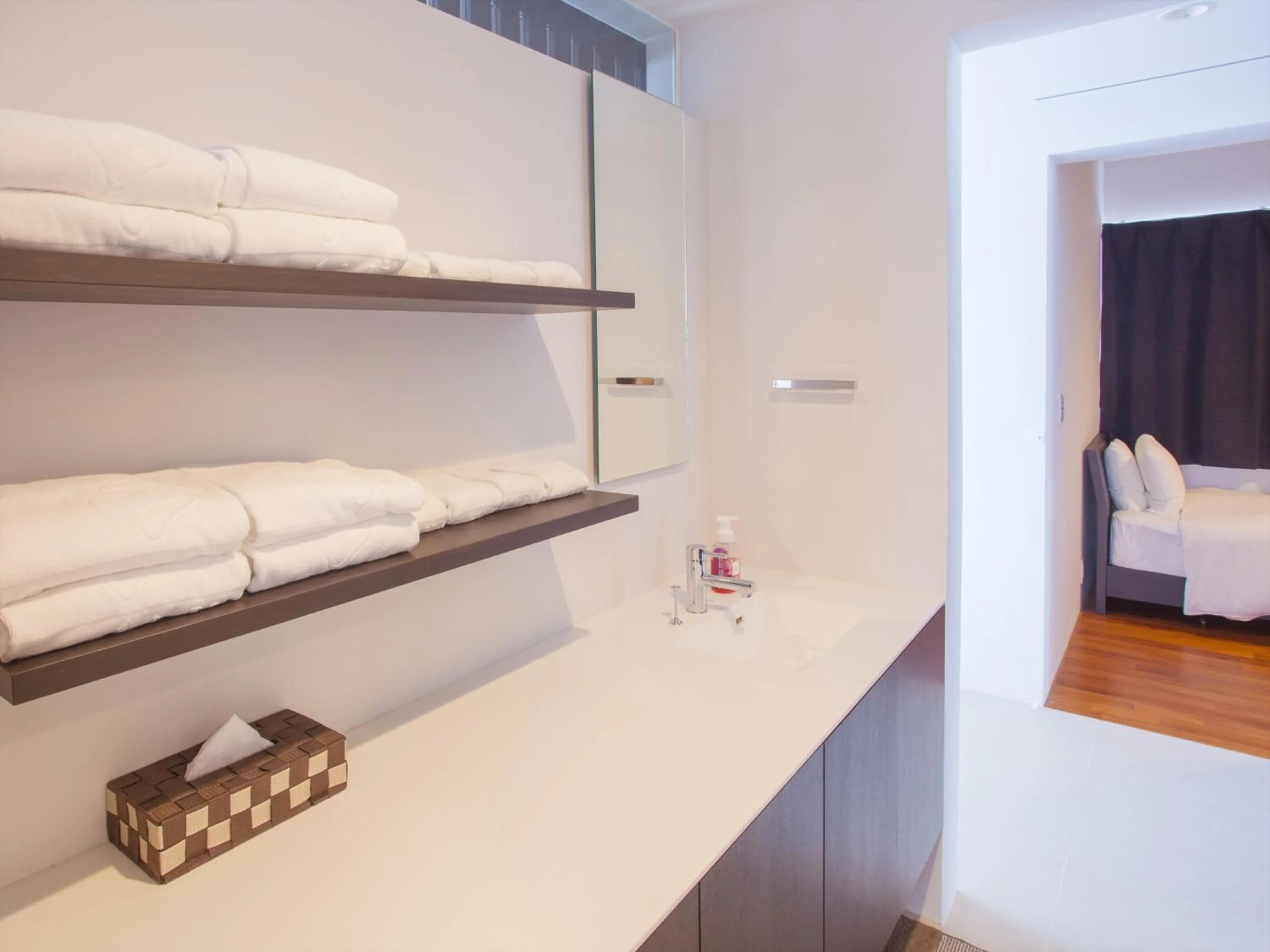 Bathroom, Bed in Kariyushi Condominium Resort Onna Maeda Base