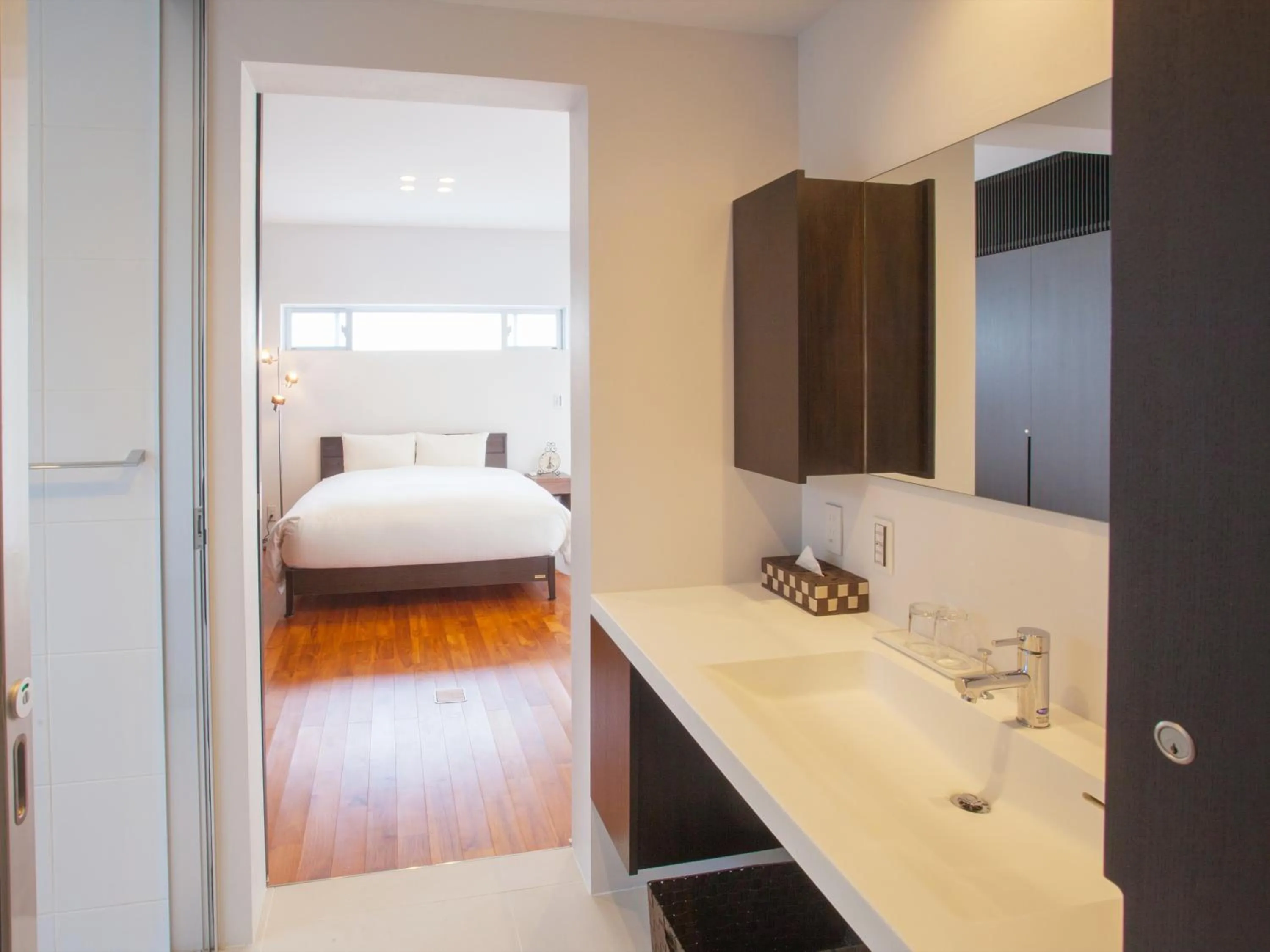 Bathroom, Bed in Kariyushi Condominium Resort Onna Maeda Base