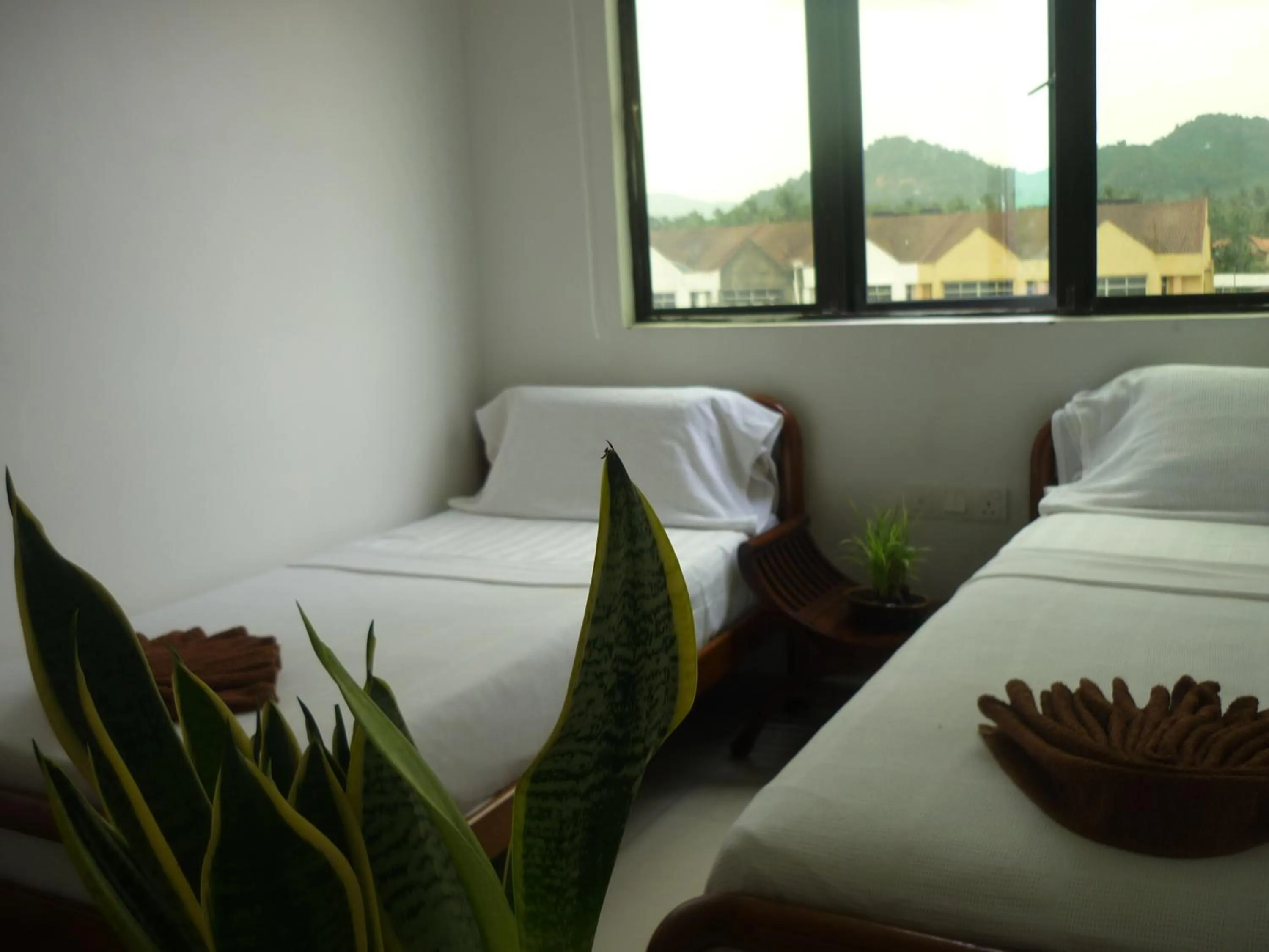 Bed in Hotel Paka INN