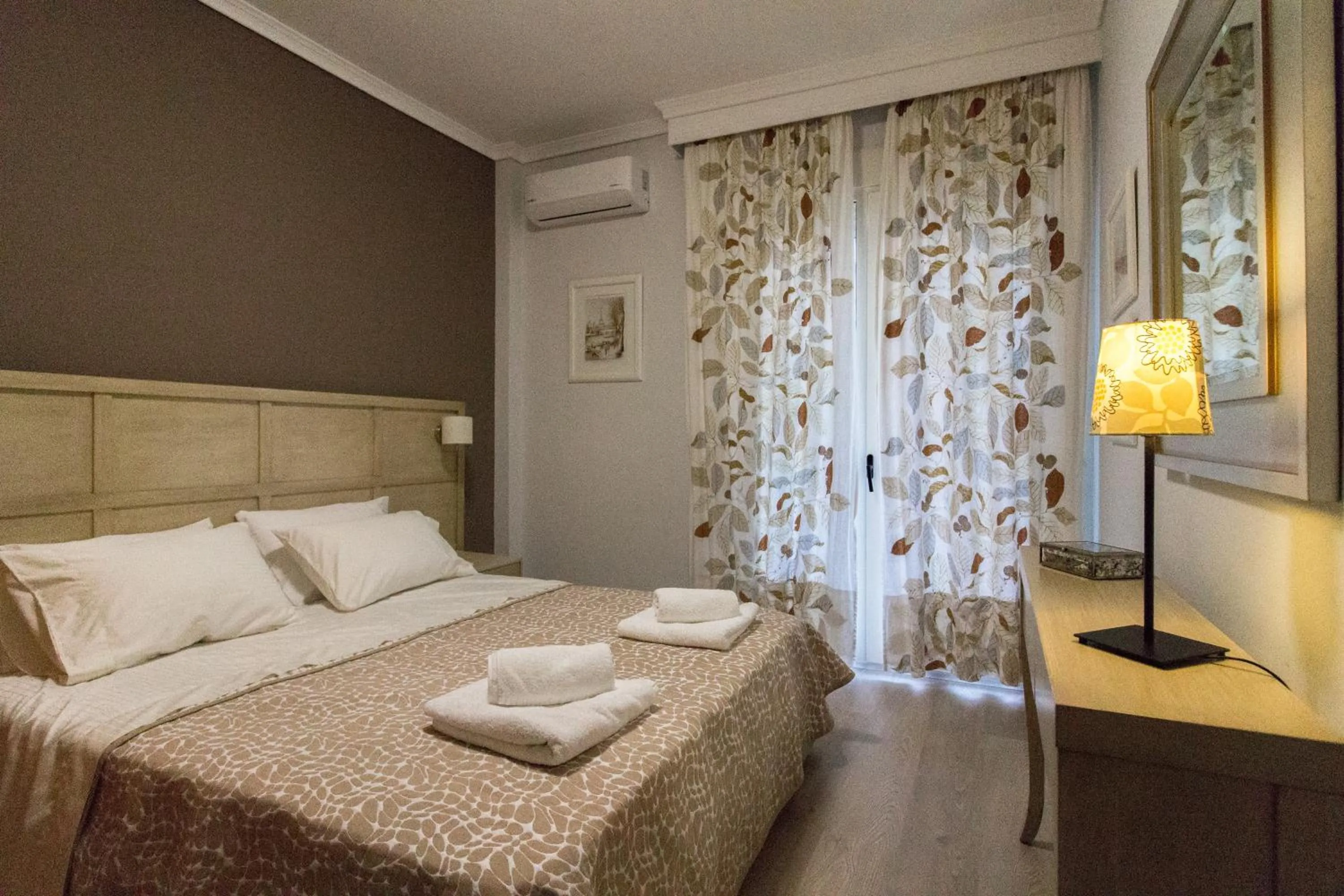 Bed in Luxury Apartment Philoxenia