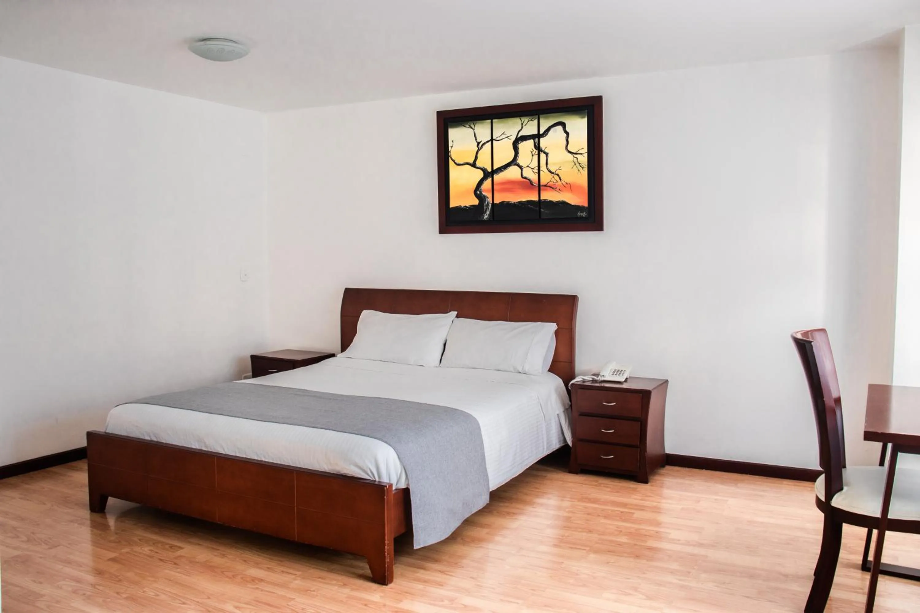 Photo of the whole room, Bed in Nogal Suite Hotel Pasto