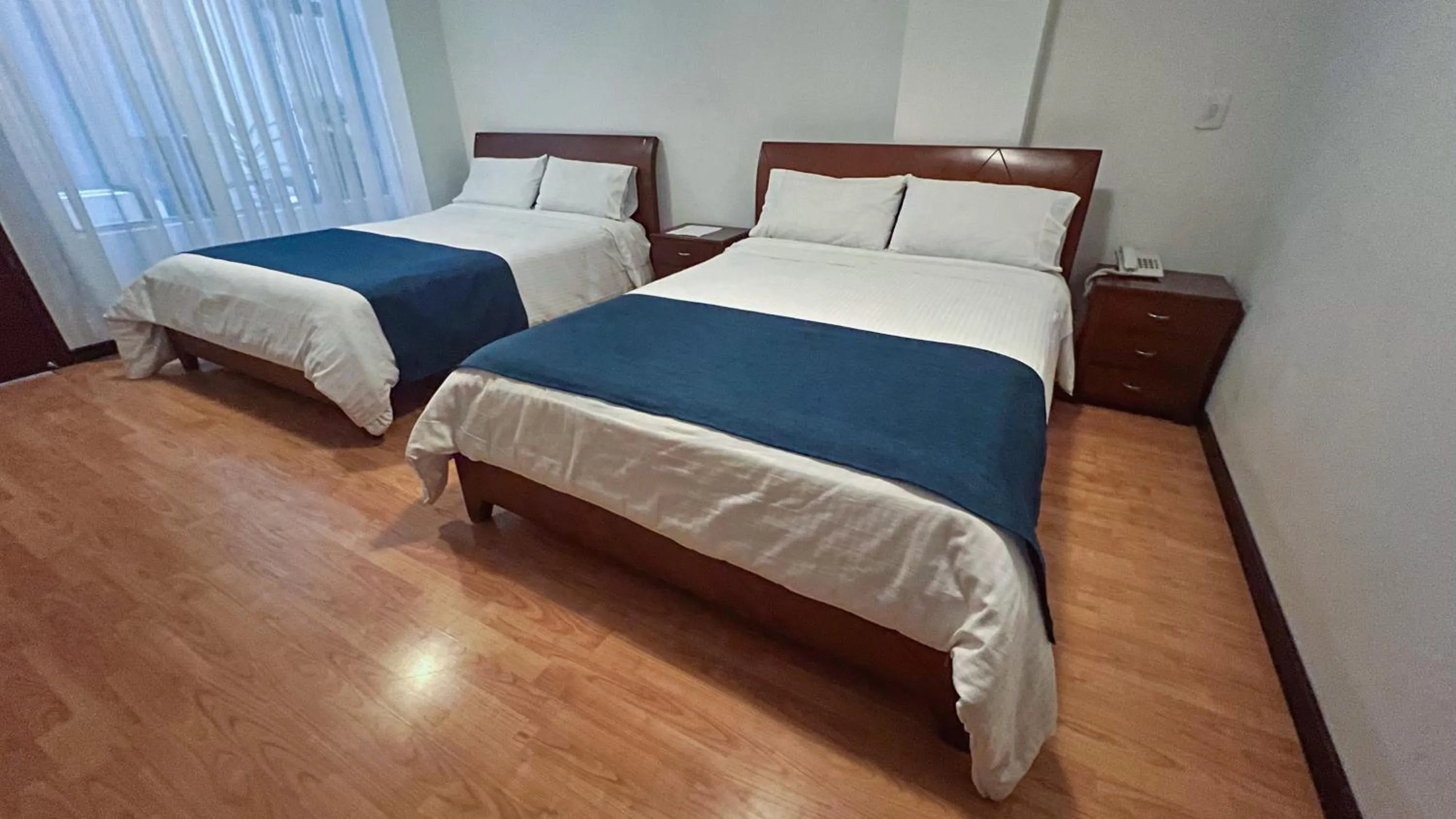 Bed in Nogal Suite Hotel Pasto