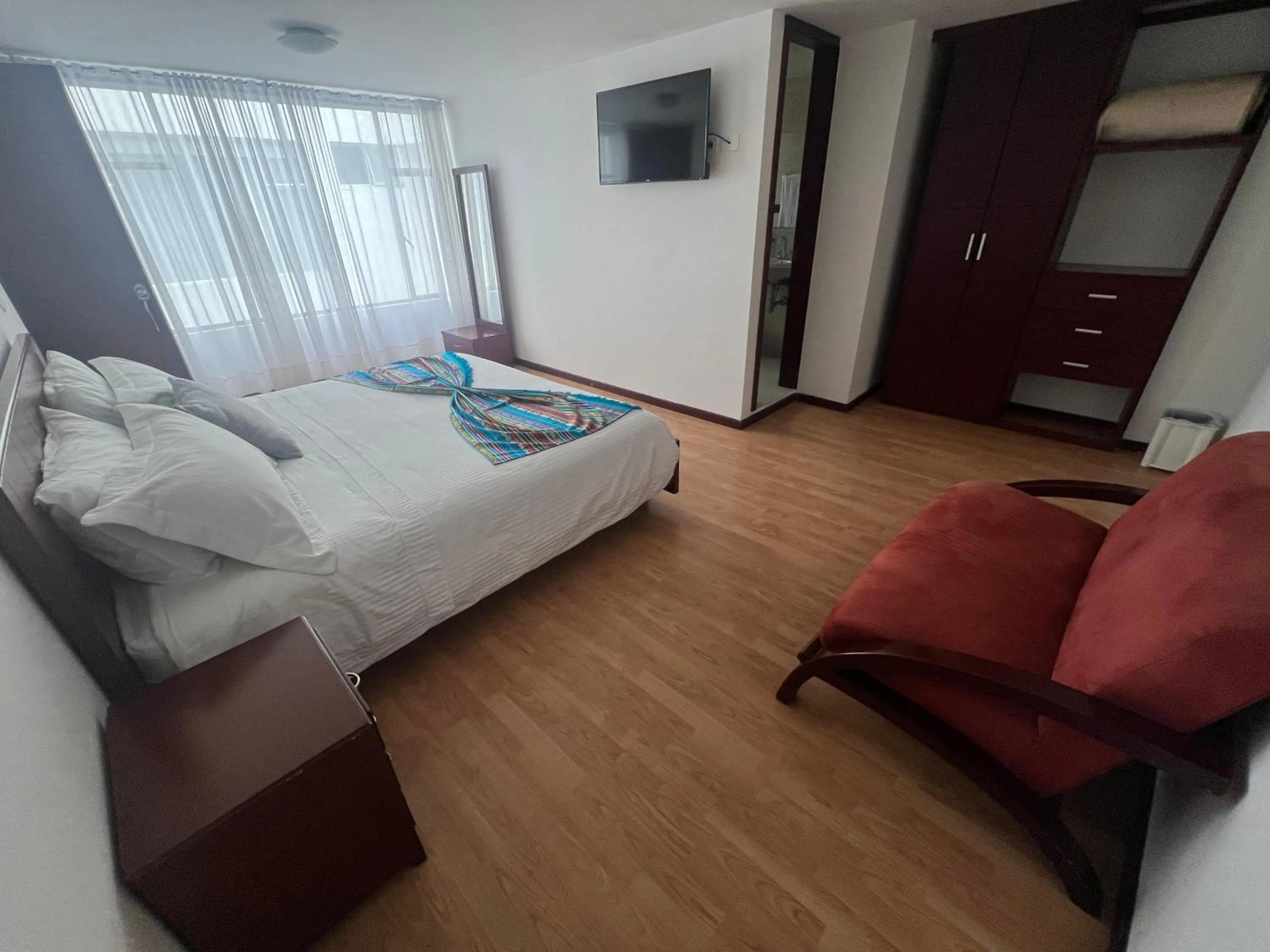 Photo of the whole room, Bed in Nogal Suite Hotel Pasto