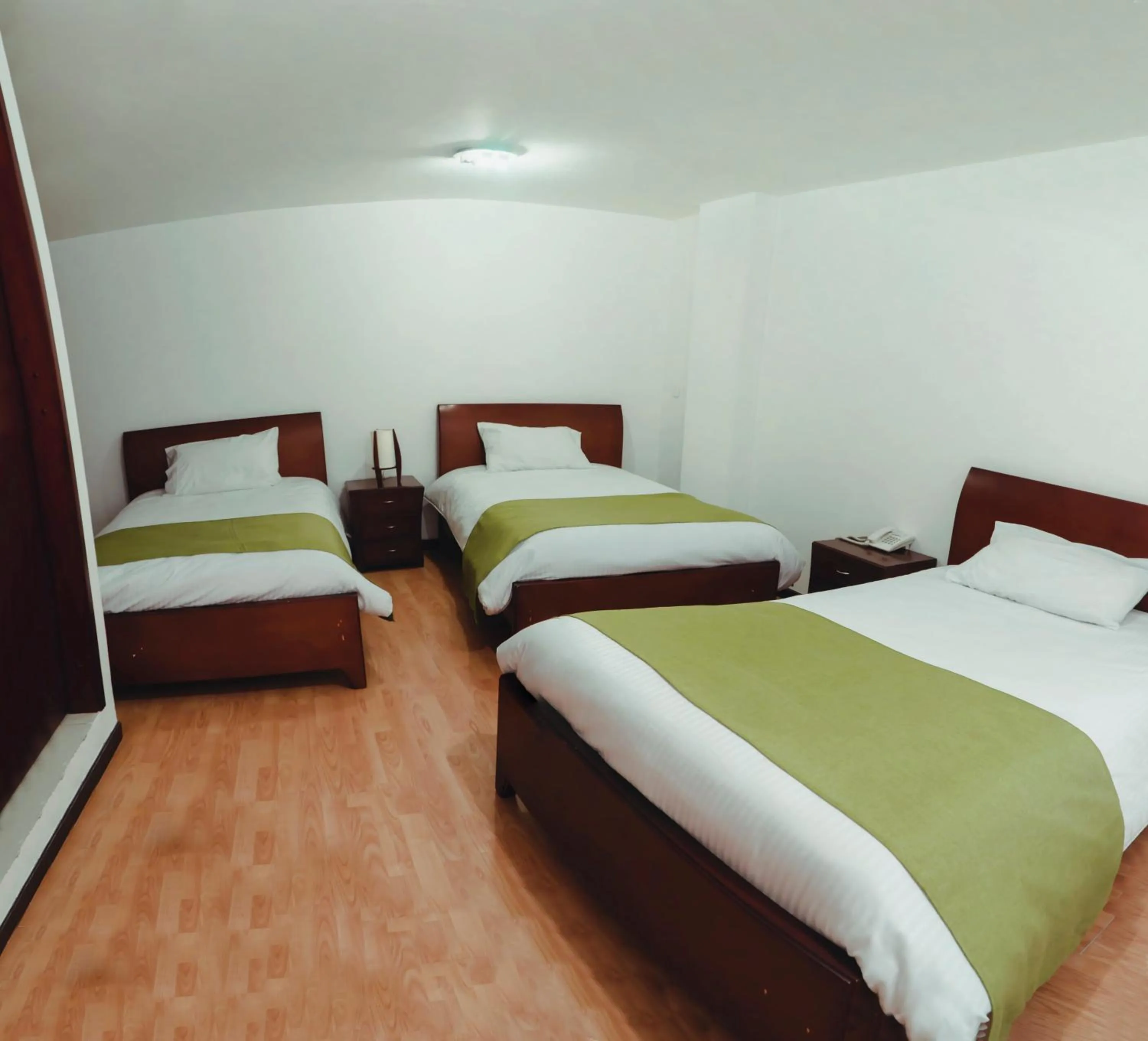Bed in Nogal Suite Hotel Pasto
